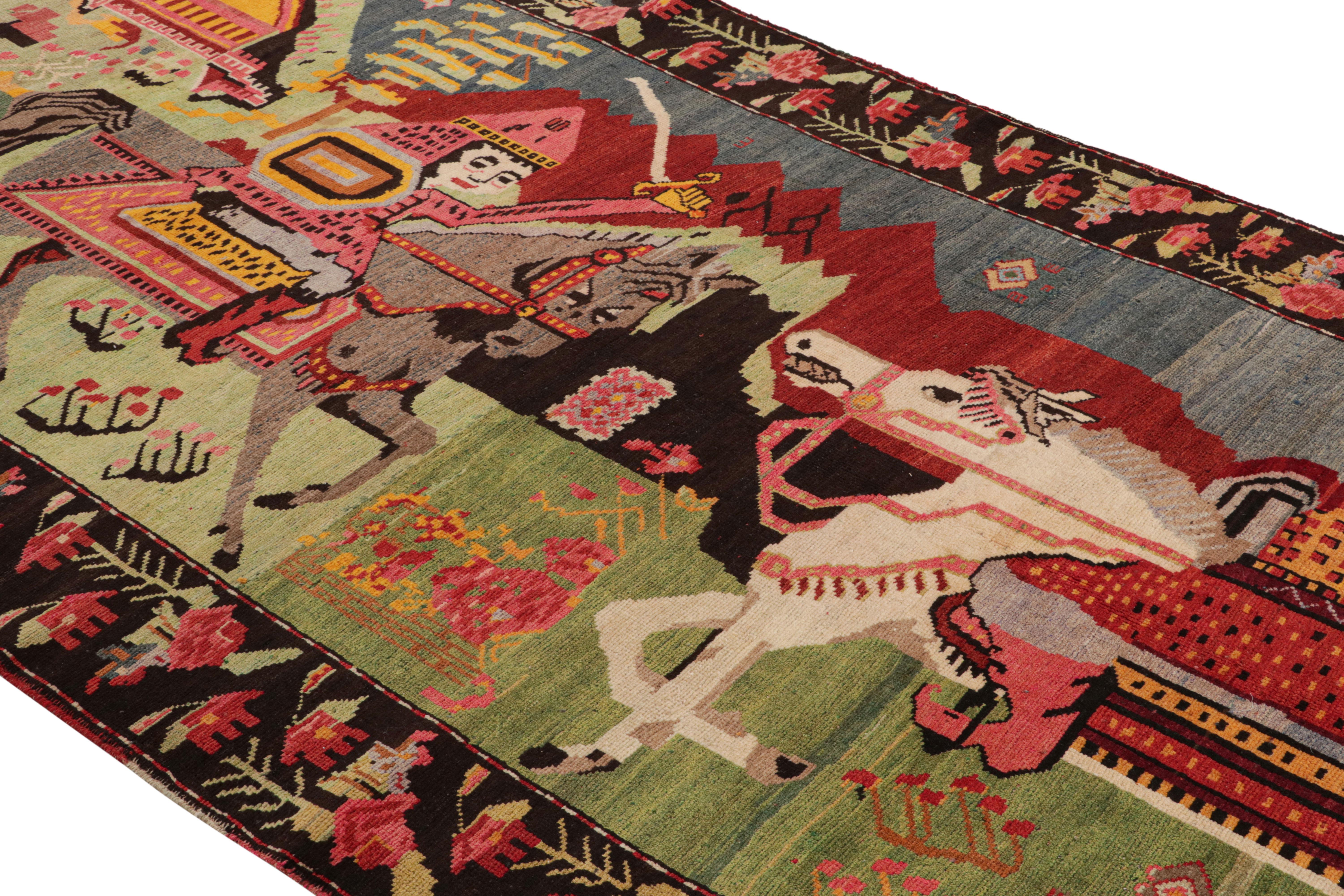 Hand knotted in wool originating from Turkey circa 1950-1960, this midcentury vintage pictorial rug enjoys a vivid marriage of colorway and uncommon pictorial pattern, depicting Classic riding warrior motifs on horseback against a lush village