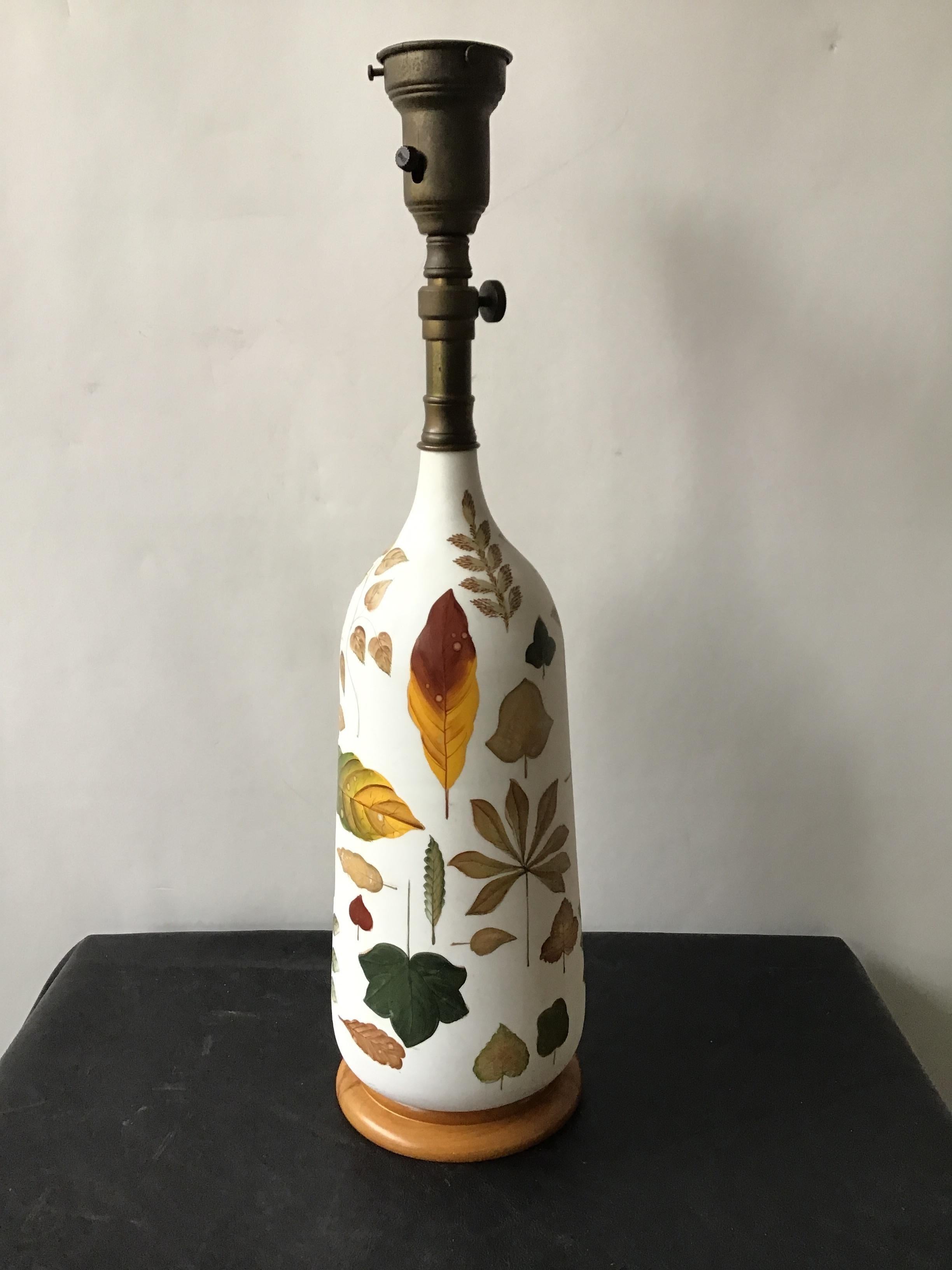 1950s hand painted on glass leaf lamp on wood base.