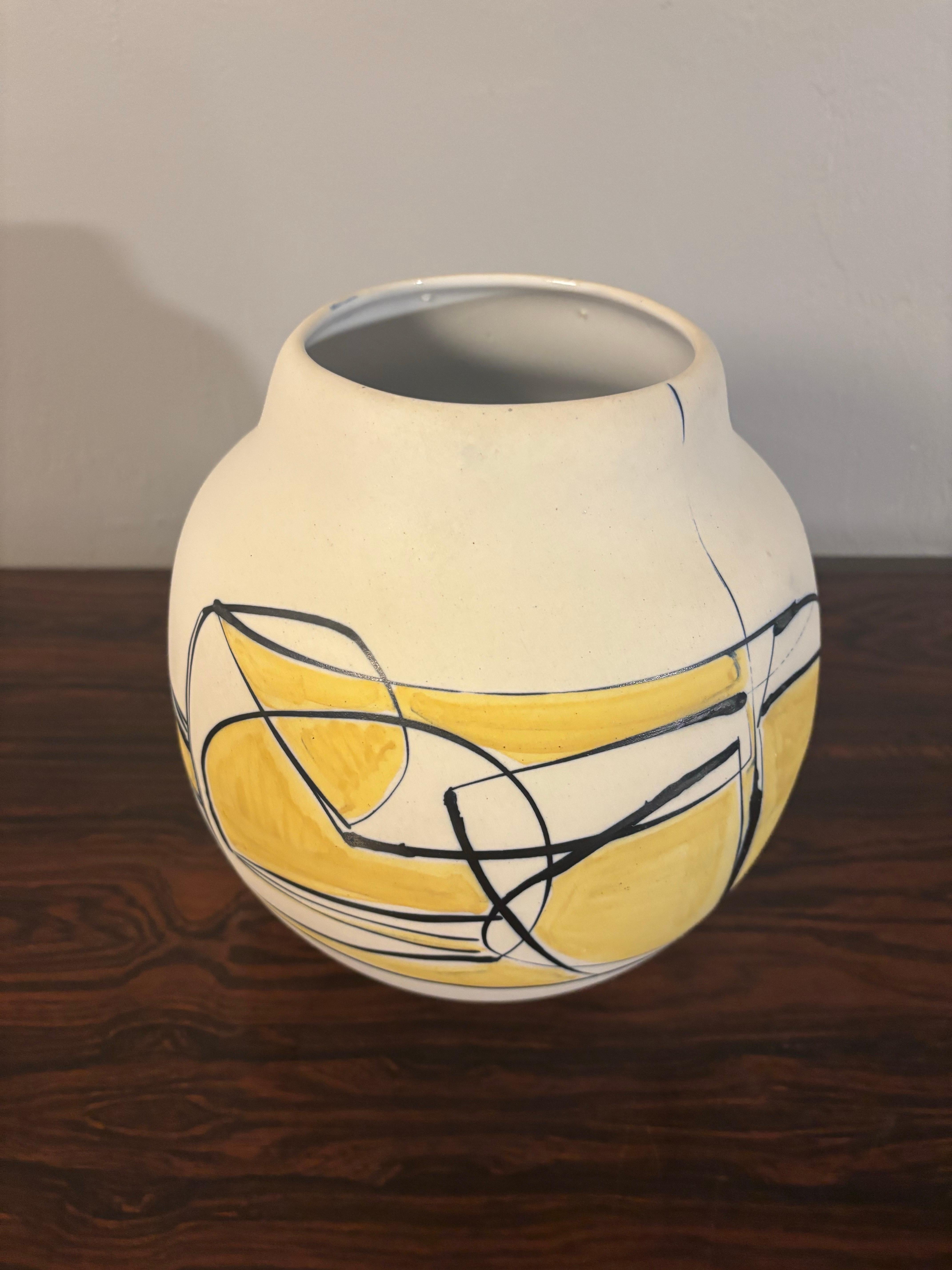 A beautiful Harsa pottery vase. Made in Beersheva Israel between 1956 and 1960. Designed by Nehemiah Azaz. Flowing organic form with a striking mix of yellow and black glaze creating an exceptional example of Mid Century Modern Studio pottery.