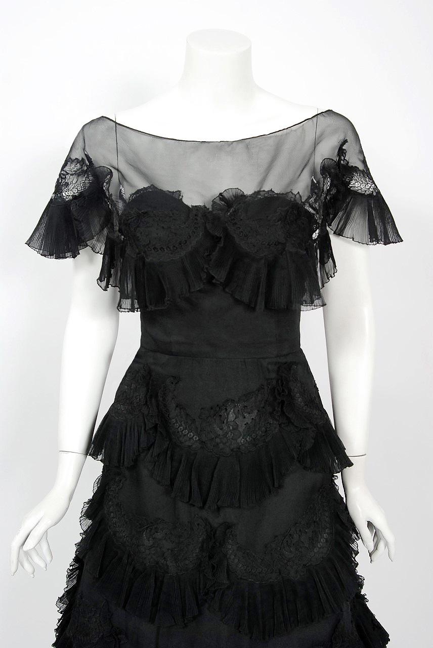 Breathtaking Harvey Berin designer black silk-chiffon and lace party dress dating back to the mid 1950's. Harvey Berin opened his business in 1921, and by the 1940's he was an important name in women's fashion. His designer, Karen Stark, adapted the