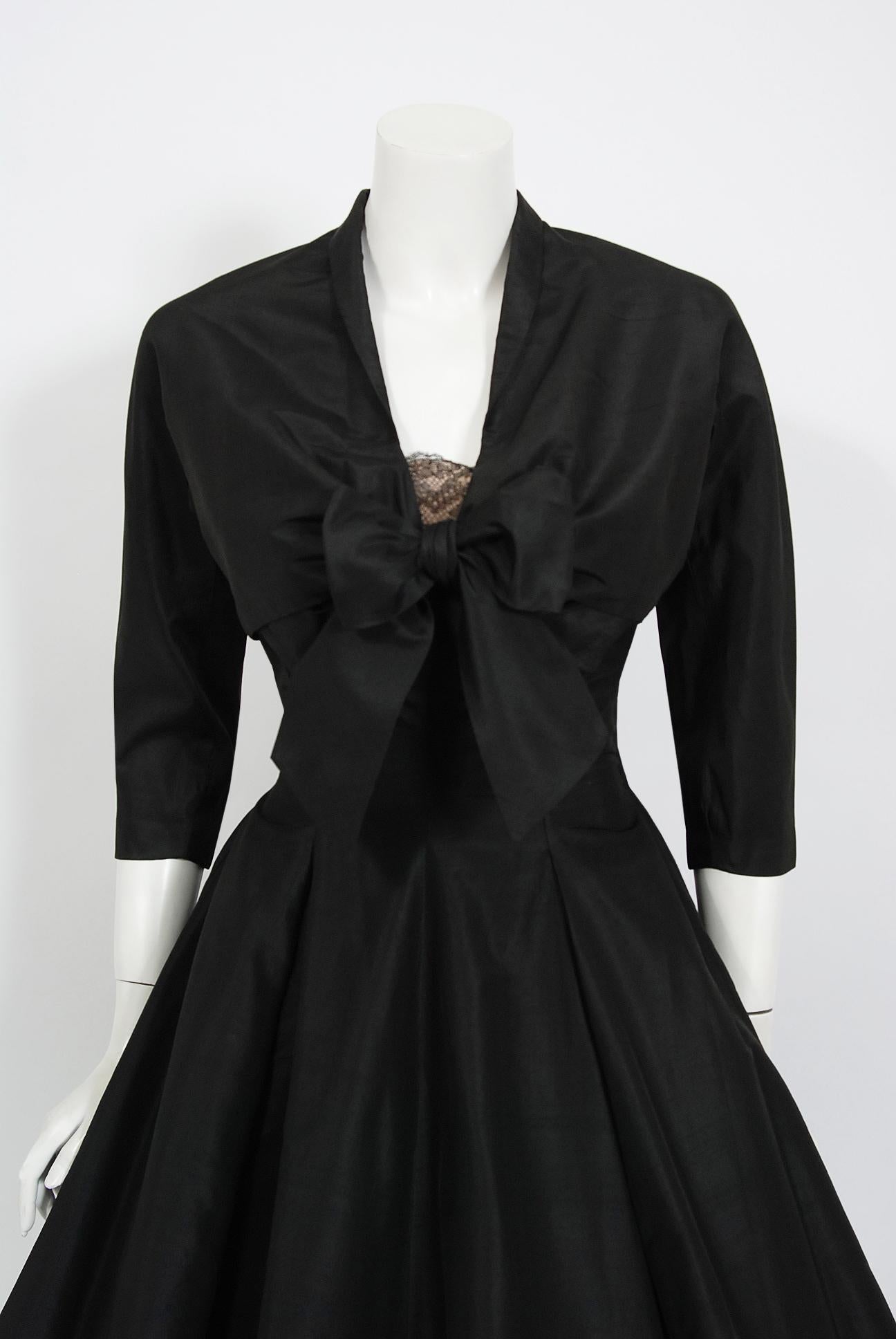 Breathtaking Harvey Berin designer black silk and chantilly lace party dress dating back to the mid 1950's. Harvey Berin opened his business in 1921, and by the 1940's he was an important name in women's fashion. His designer, Karen Stark, adapted