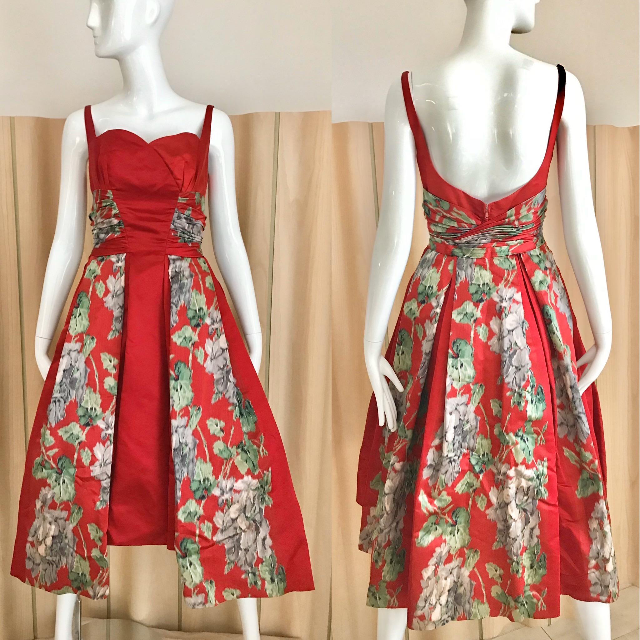 Stunning 1950s Red Silk Satin in green and grey floral print dress from Hattie Carnegie.
Spaghetti straps and fitted in the waist with low back.
Bust : 32”/ rib Cage 18”/ waist : 26”/ Dress length from strap to hem : 46” and there is an additional