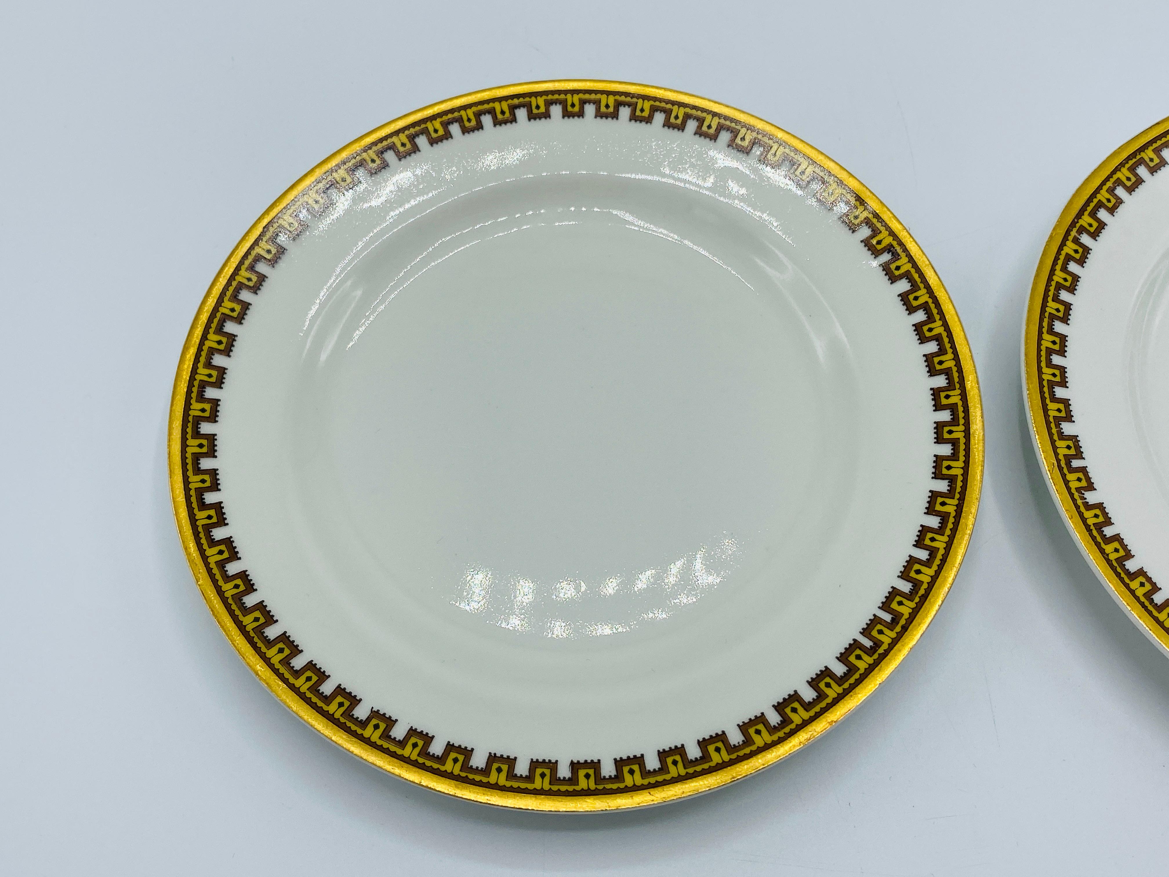 Listed is a stunning, set of 2, Haviland & Co. for Limoges France dessert plates, circa 1950s. The set is in the highly sought after 'Schleiger 962 - H SCH962' greek key geometric pattern. An elegant and sophisticated china pattern, with golden