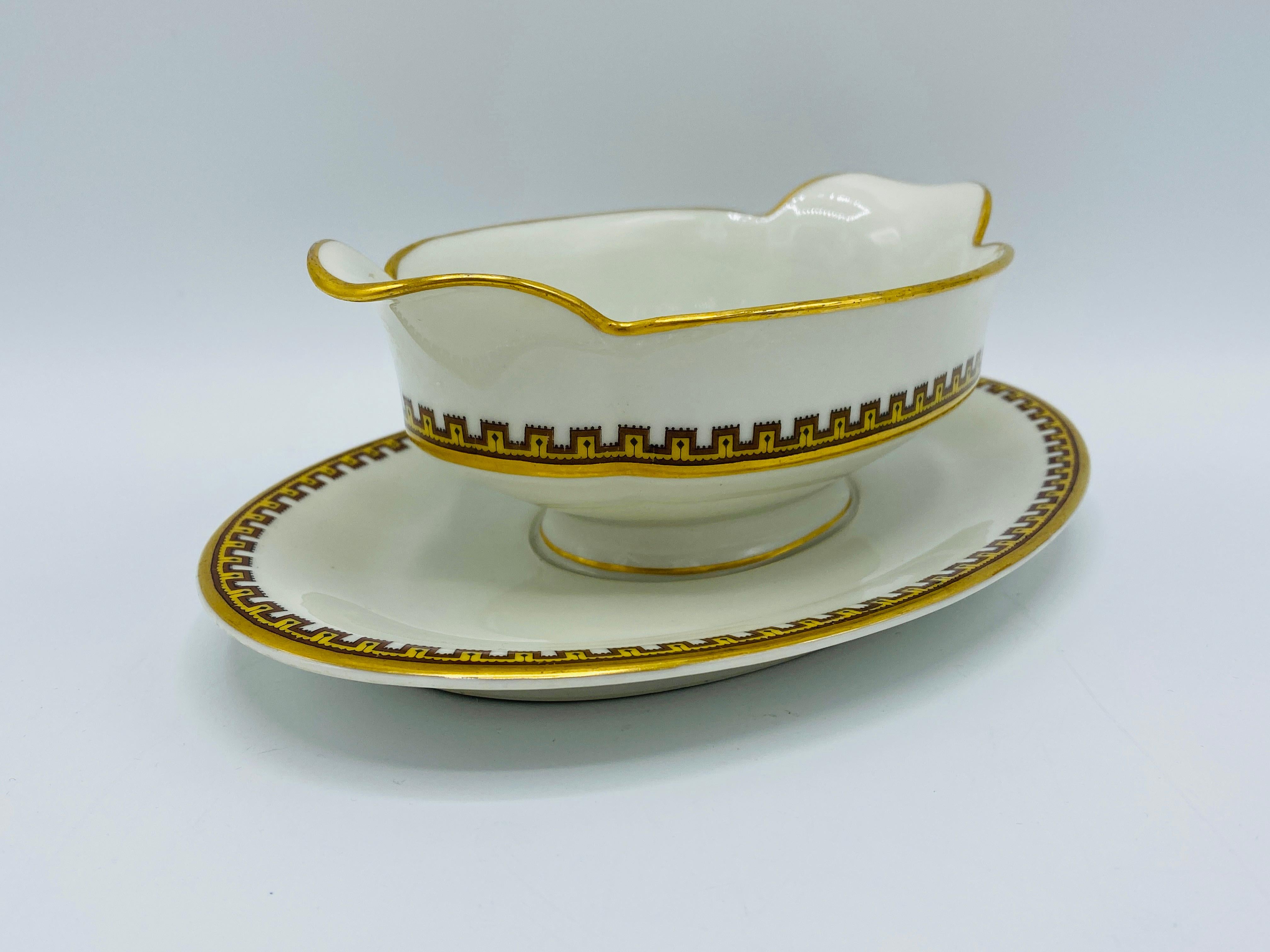 Listed is a stunning, Haviland & Co. for Limoges France saucière gravy boat, circa 1950s. The piece is in the highly sought after 'Schleiger 962 - H SCH962' greek key geometric pattern. An elegant and sophisticated china pattern, with golden yellow