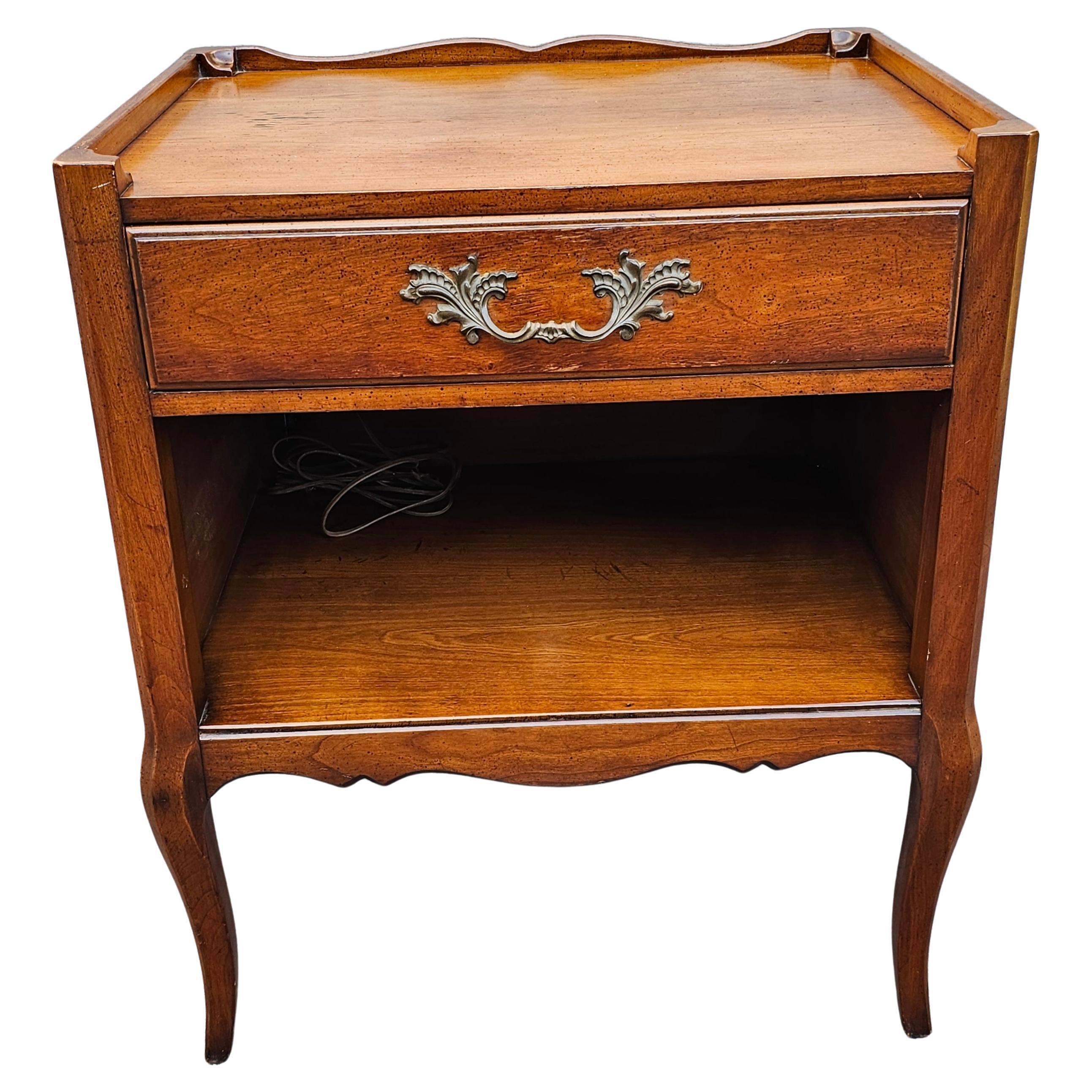 A mid 20th Century Hanredon Furniture French Walnut single drawer side table. Pre-wired for your table lamp and other electrical devices. Measures 22.5