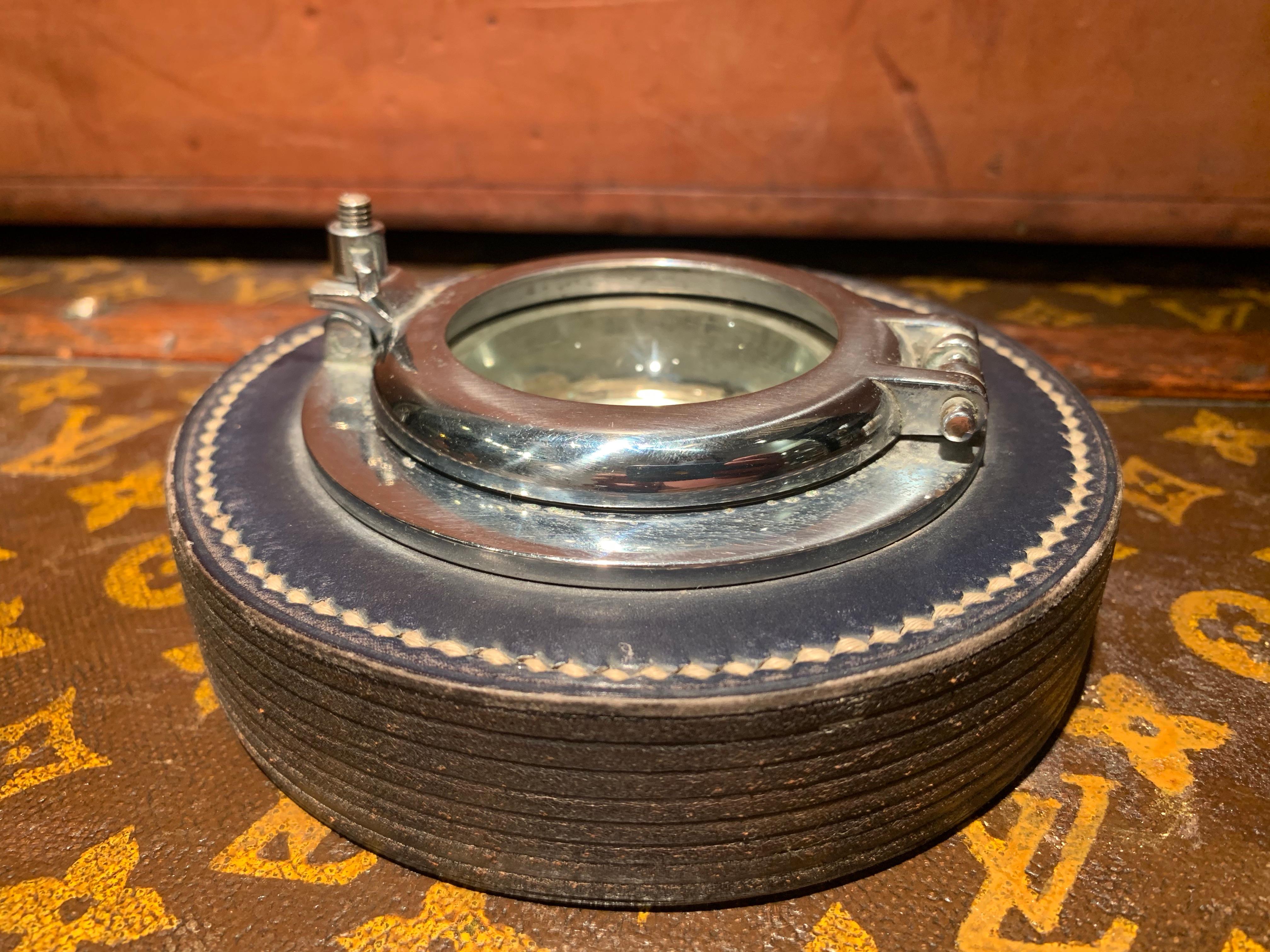 Rare 1950s Hermès ashtray in the shape of a small porthole, designed by Paul Dupré-Lafon (1900-1971)
Stamped Hermès/ Paris underneath
Dark Blue/ Black leather
Condition:
The leather top is slightly damage on the top, the chrome porthole has some