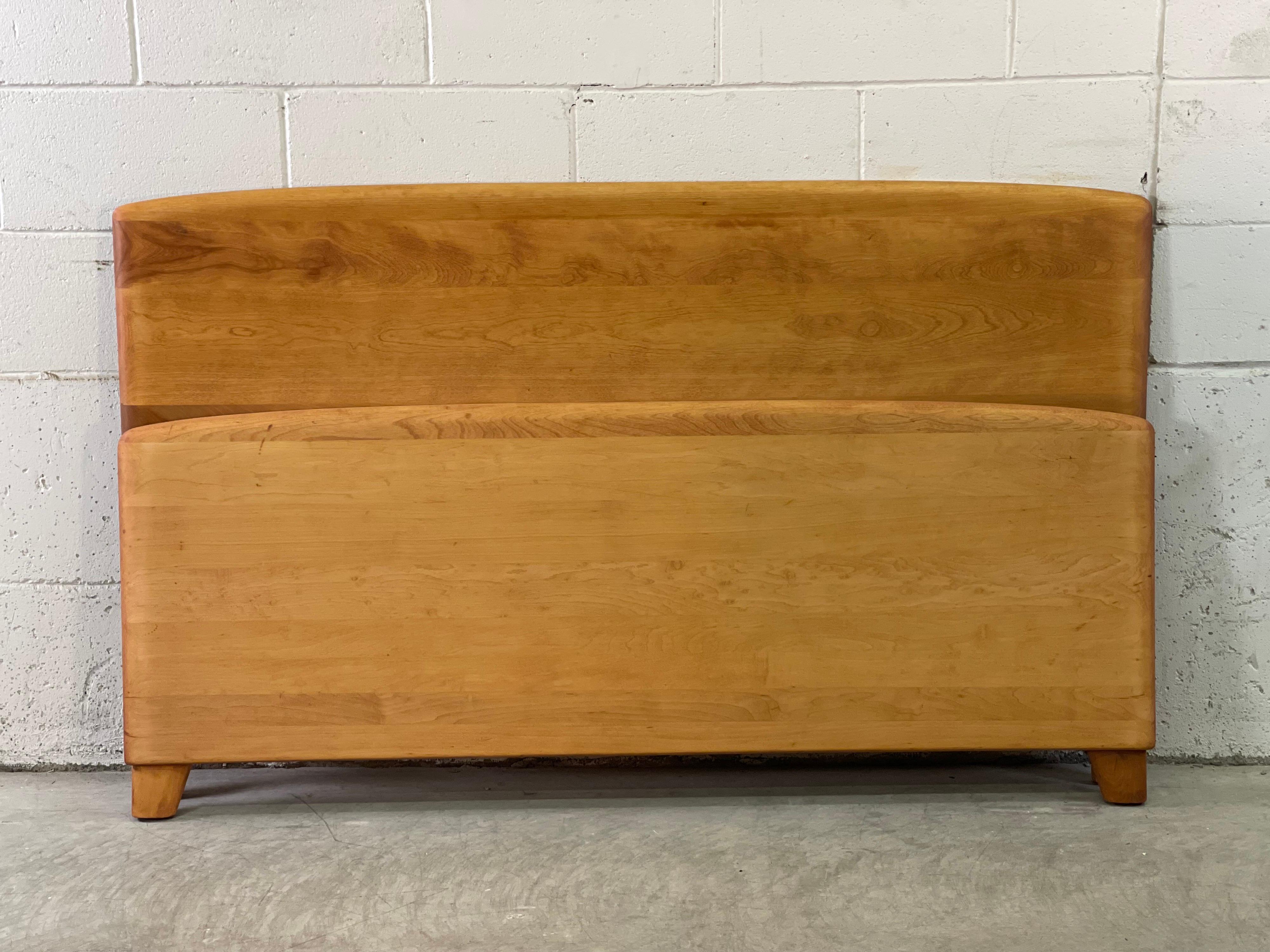 Vintage 1950s maple wood headboard and footboard set. Rails are not included. The set has been fully refinished. Footboard measures: 57” L x 23” H. Marked on the back.
