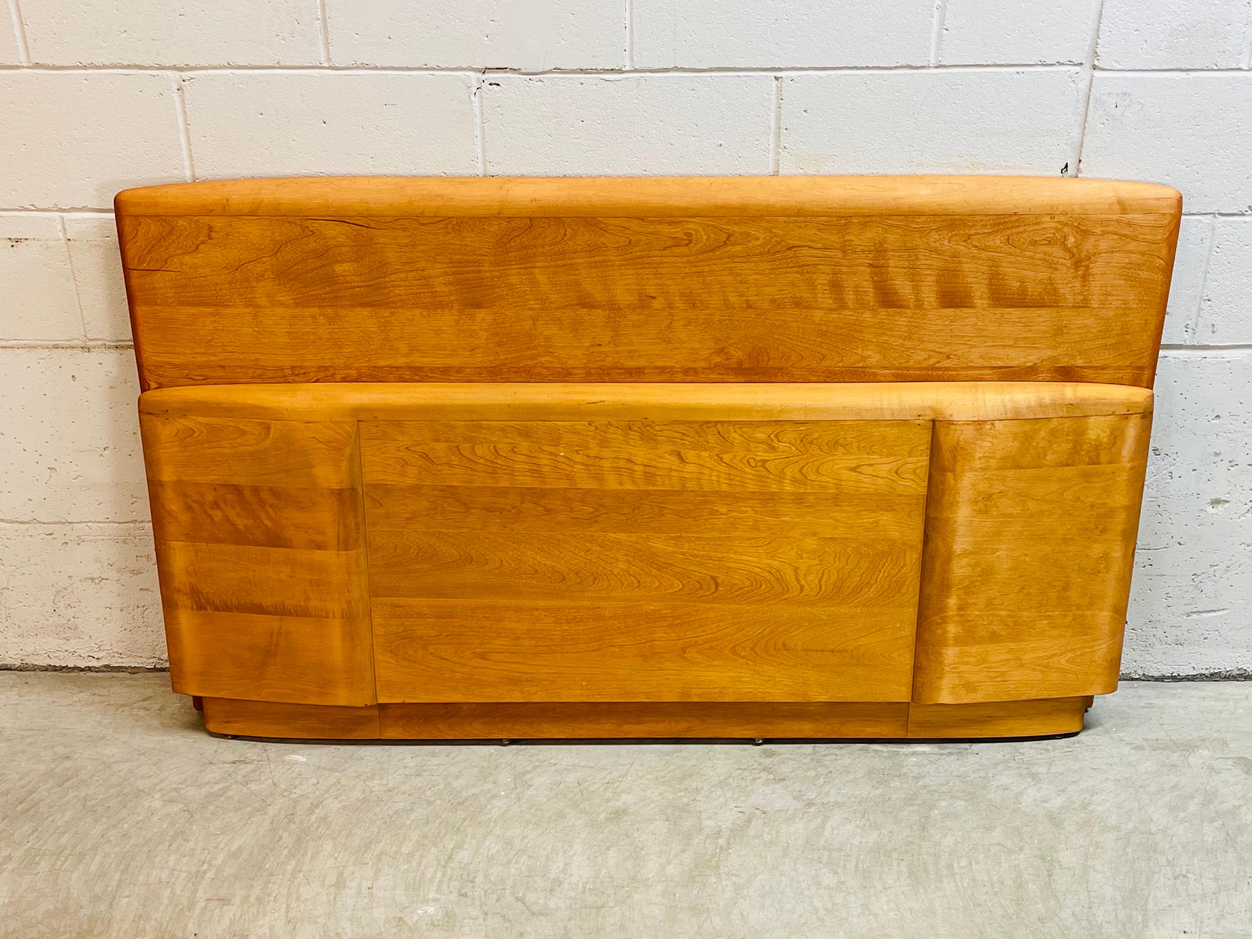 Vintage 1950s Heywood Wakefield maple wood full/double bed head and foot board set. The set does not include the rails. The foot board measures 58”L x 23”H. Both are marked and in refinished condition.