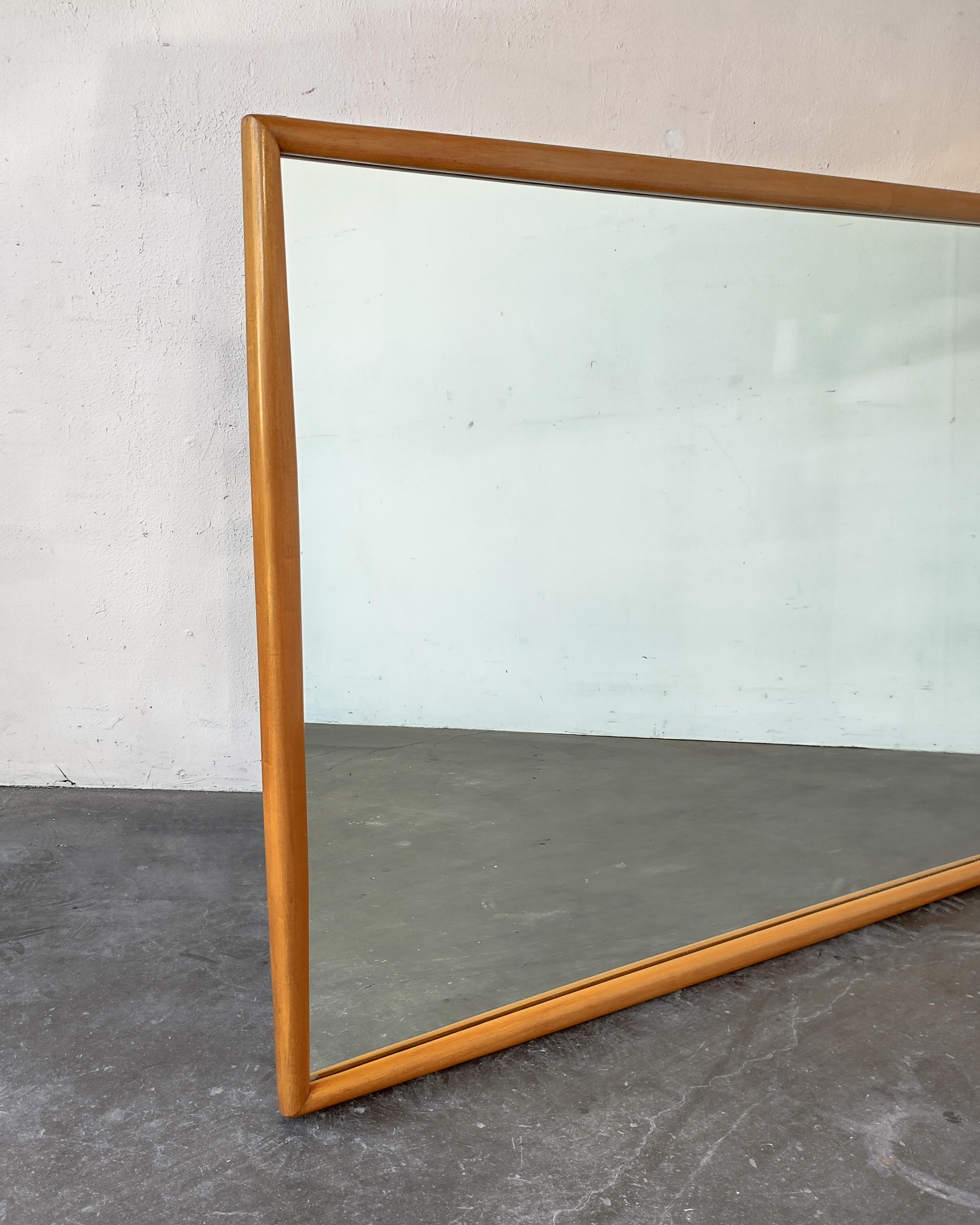 Large Heywood Wakefield blonde wood framed mirror circa 1940s/50s. Lovely design where the wood tapers at each corner. Overall great vintage condition, some very light wear. Hanging hardware attached upon request, can be hung horizontal or