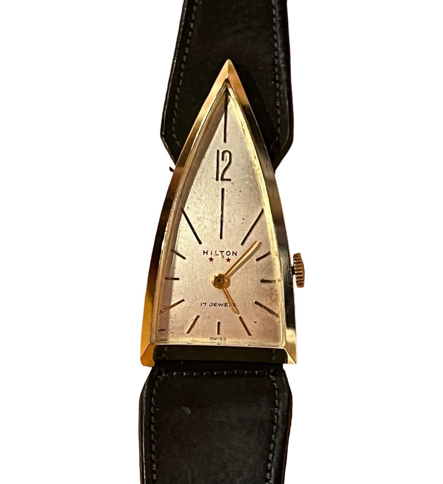 1950's Hilton 17 Jewels Triangle Wrist Watch
Casual, minimalistic, unique and rare watch. This watch is formal yet easy to wear and style and can dress up any outfit!
This watch was popular in Hollywood and New York fashion scenes and it was also