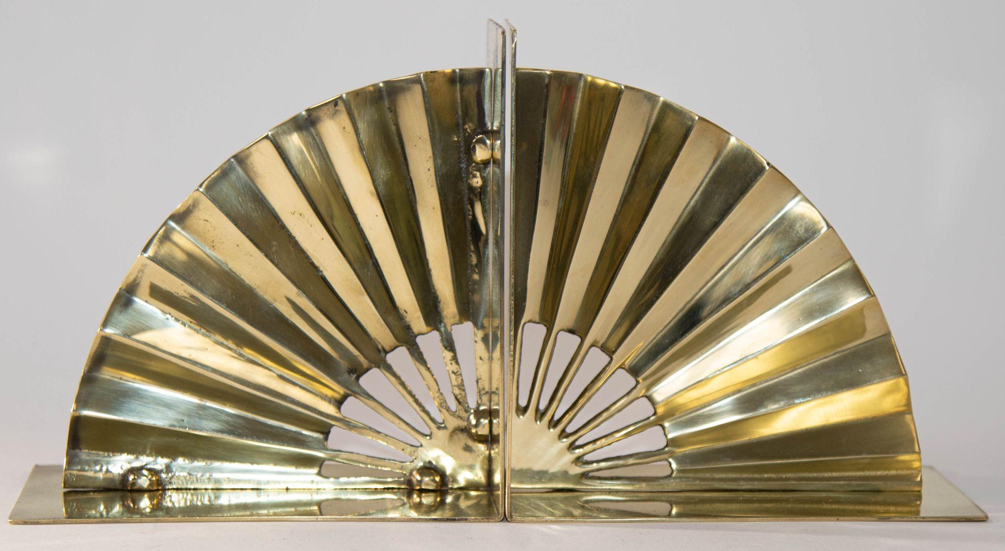 1950s Hollywood Regency Solid Polished Brass Asian Fan Shaped Bookends.
These are stunning and highly decorative set of fan form bookends.
Circa 1950s. A Fine Pair of Brass Fan Bookends.
These Mid Century Modern polished brass Asian Fan bookends are