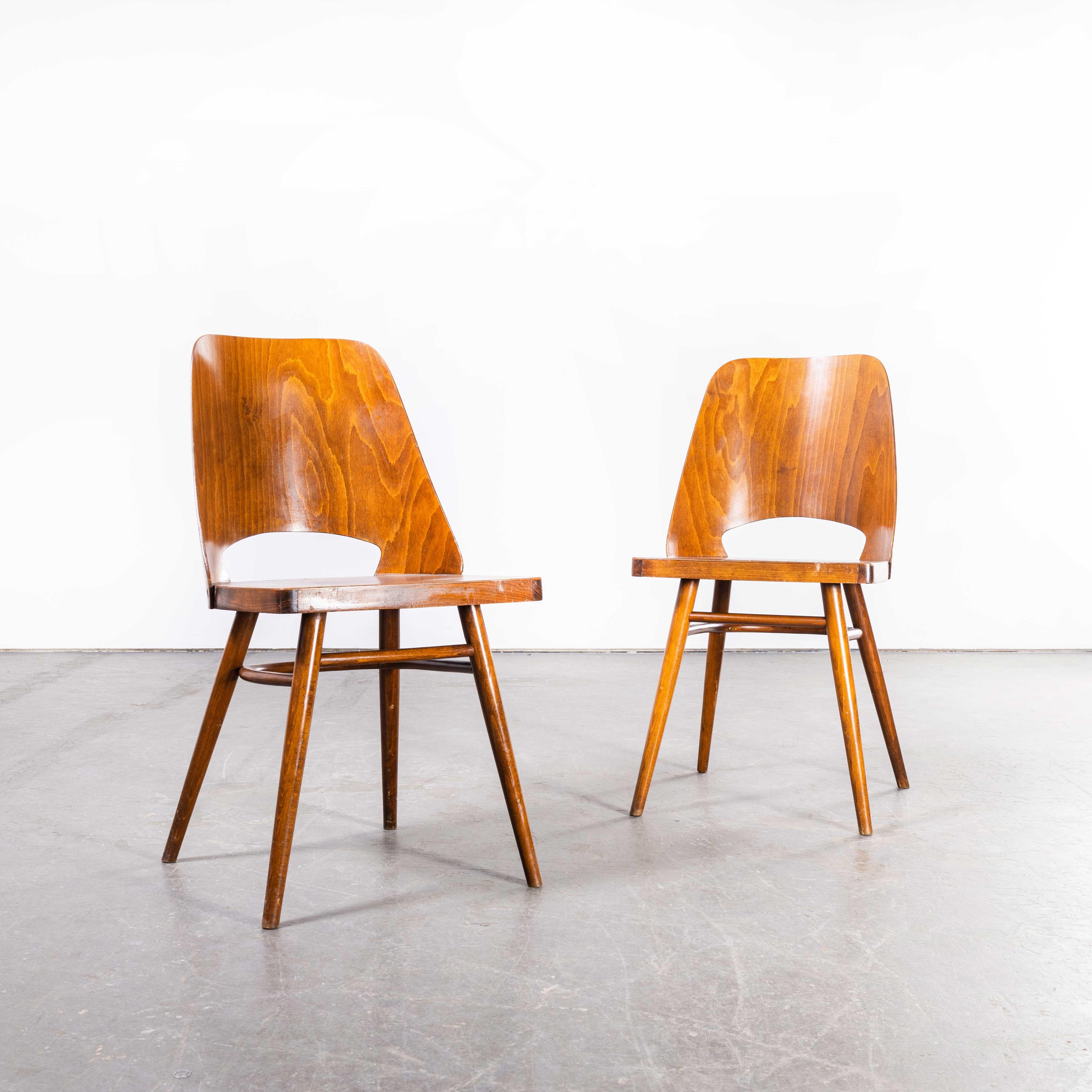 1950’s Honey Beech Dining Chairs By Radomir Hoffman – Pair
1950’s Honey Beech Dining Chairs By Radomir Hoffman – Pair. These chairs were produced by the famous Czech firm Ton, still trading today and producing beautiful chairs, they are an offshoot