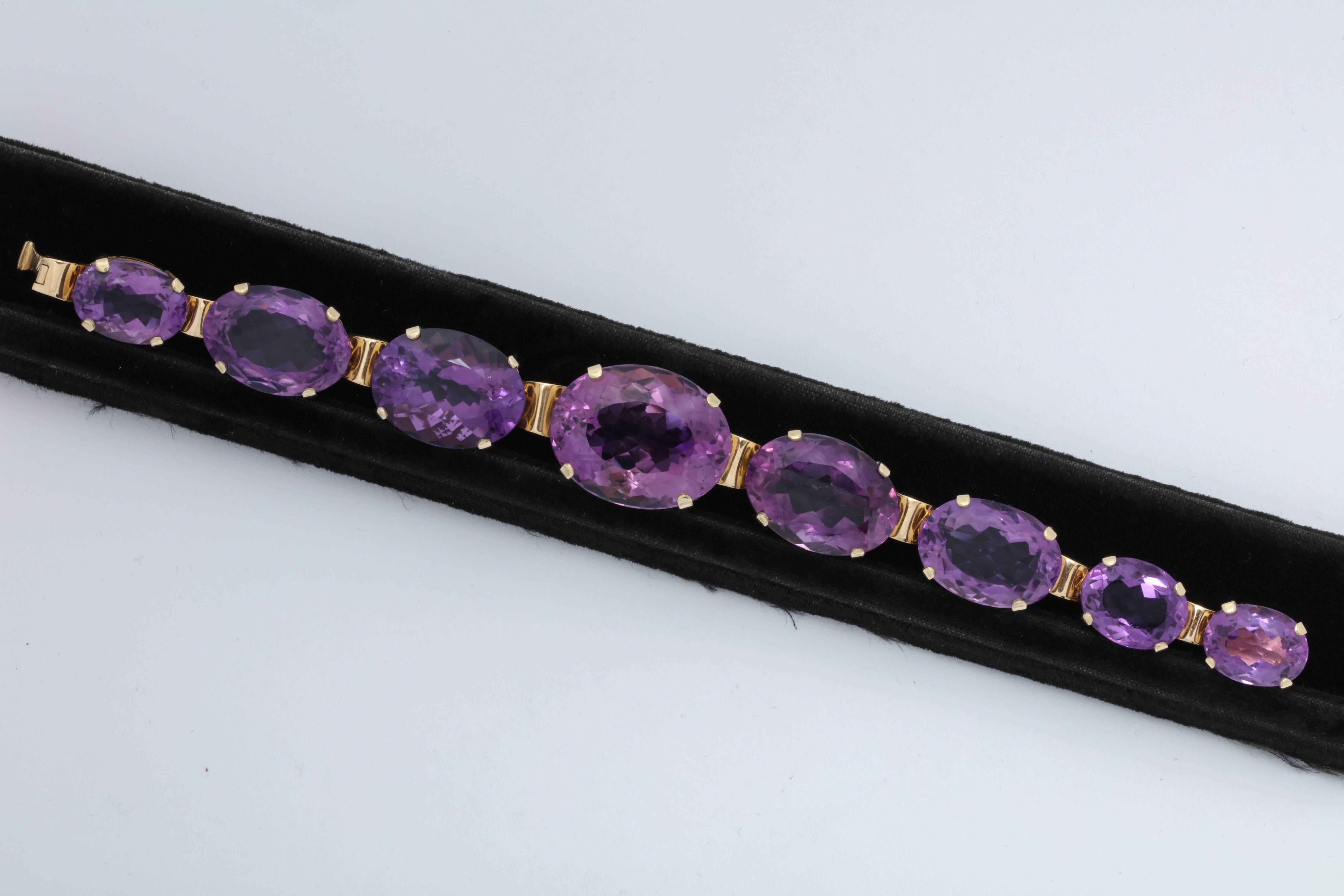 One Ladies 18kt Open And Reticulated Gold Craftmanship Is The Setting For This Horizontal Set Amethyst Link Bracelet. All Stones Are Beautifully Set In A Heavy Four Prong setting. Total Weight Of This Beautiful Gem Quality Color Amethyst Bracelet Is