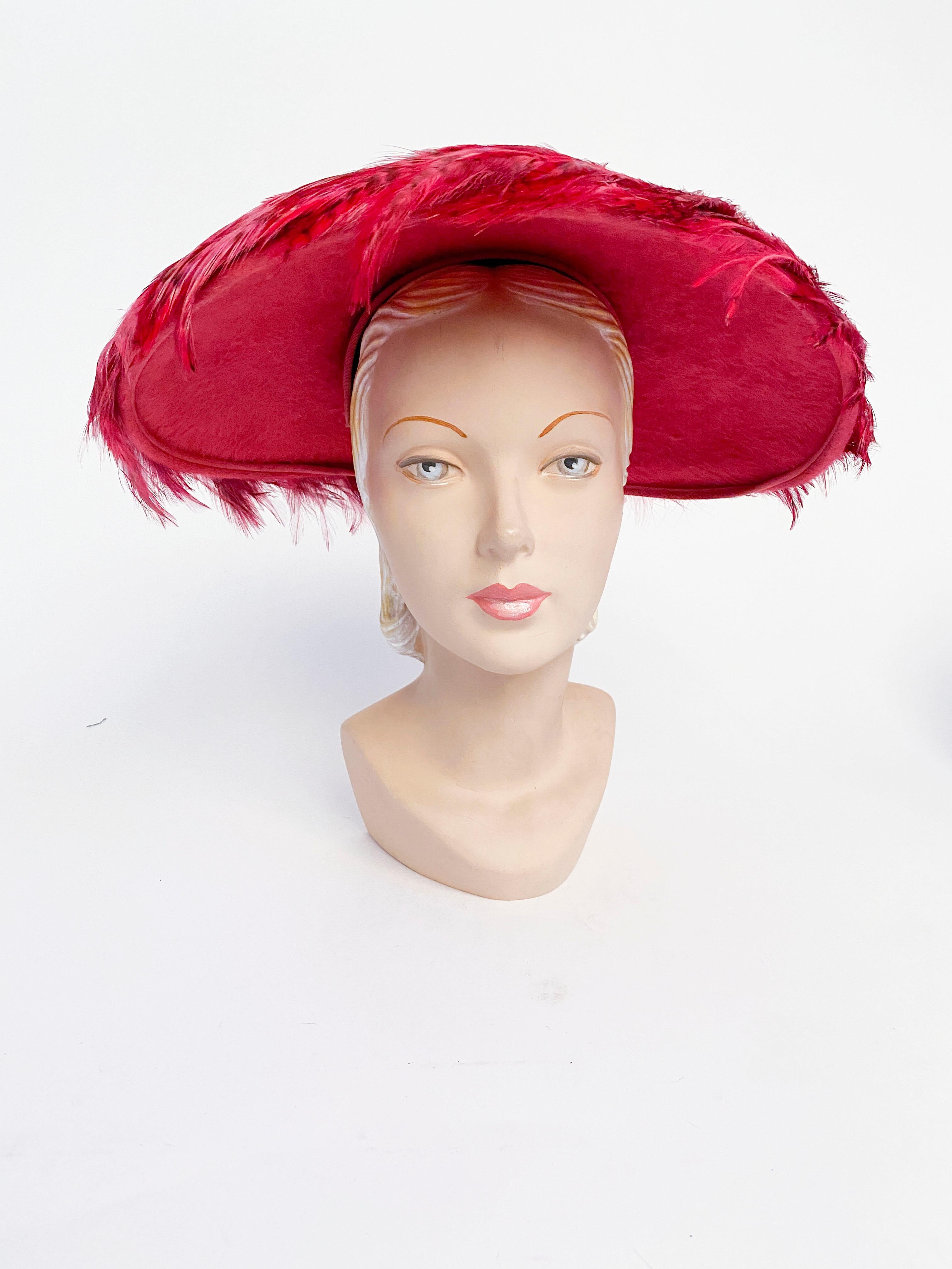 1950s hot pink and majenta wide brimmed picture hat with layered feathers in multi-tones of pink. This hat is handmade and original with custom dyed pheasant feathers on a rose pink dyed beaver fur felt.