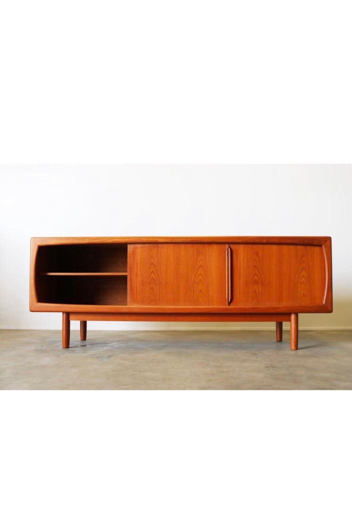 Magnificent Danish design sideboard or credenza designed by H.P. Hansen in the 1950s. The sideboard is made from solid teak and has four uniquely shaped drawers and two sliding doors. The sideboard is of high quality and in nice vintage condition.