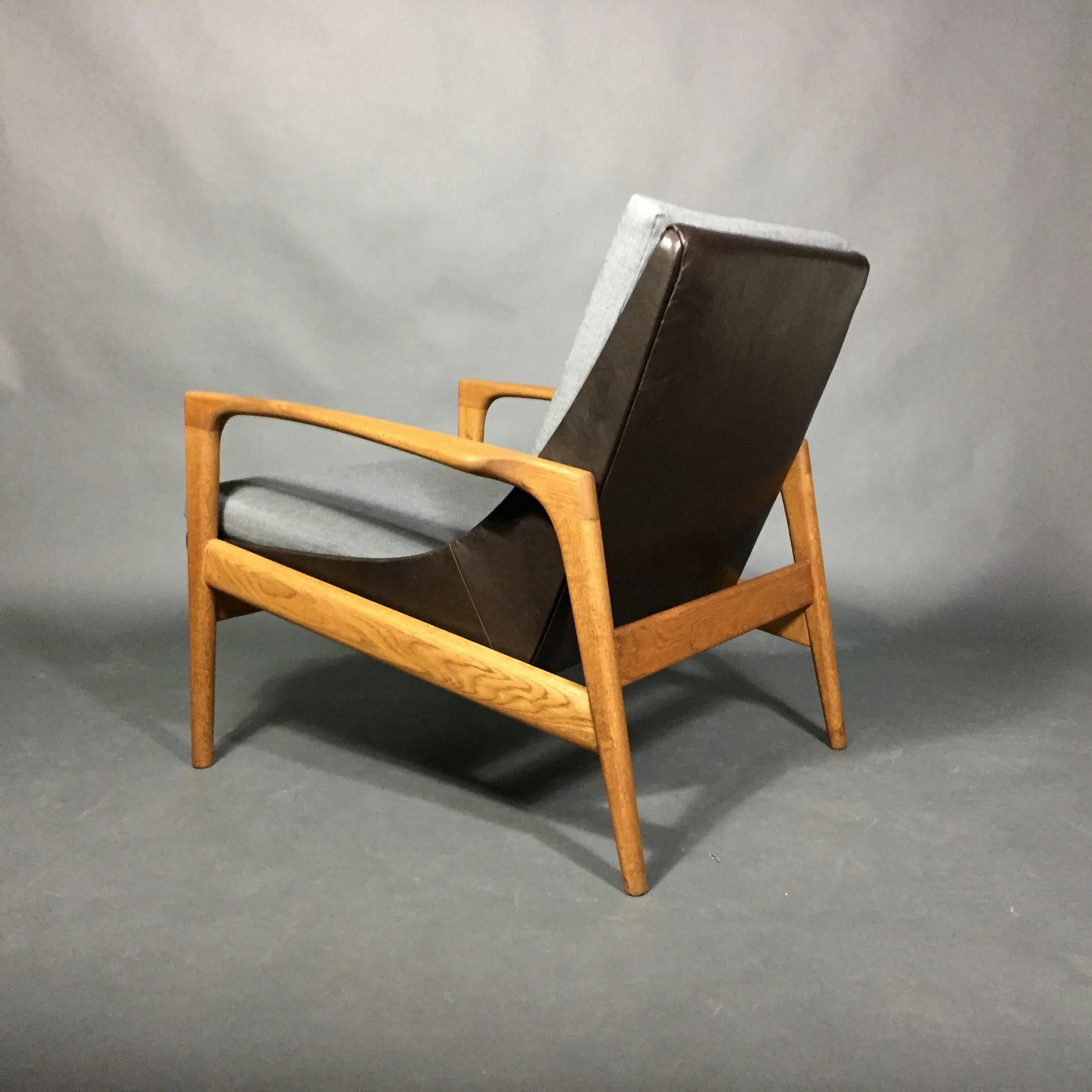 This lounge chair was manufactured by AB Trensums Fåtöljfabrik in Sweden in the 1950s and retains its original Trensums metal tag. It is unclear if designed by Ib Kofod-Larsen who was very prolific in Scandinavian design across a wide range of