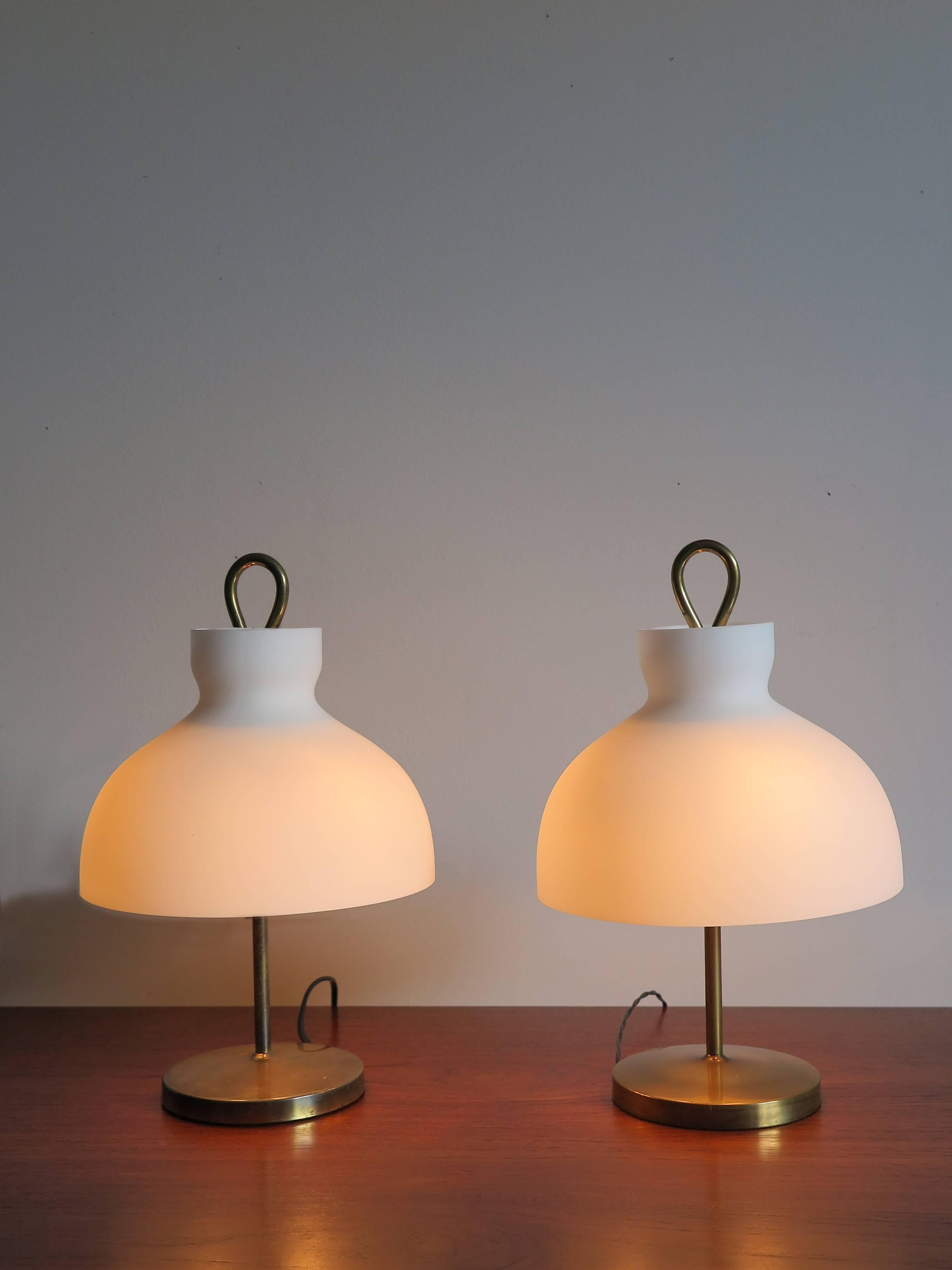 Couple of Italian table lamps model Arenzano designed by Ignazio Gardella for Azucena in 1956, no chips or scratches in the glass white shades and normal vintage patina in the brass structures, midcentury design.