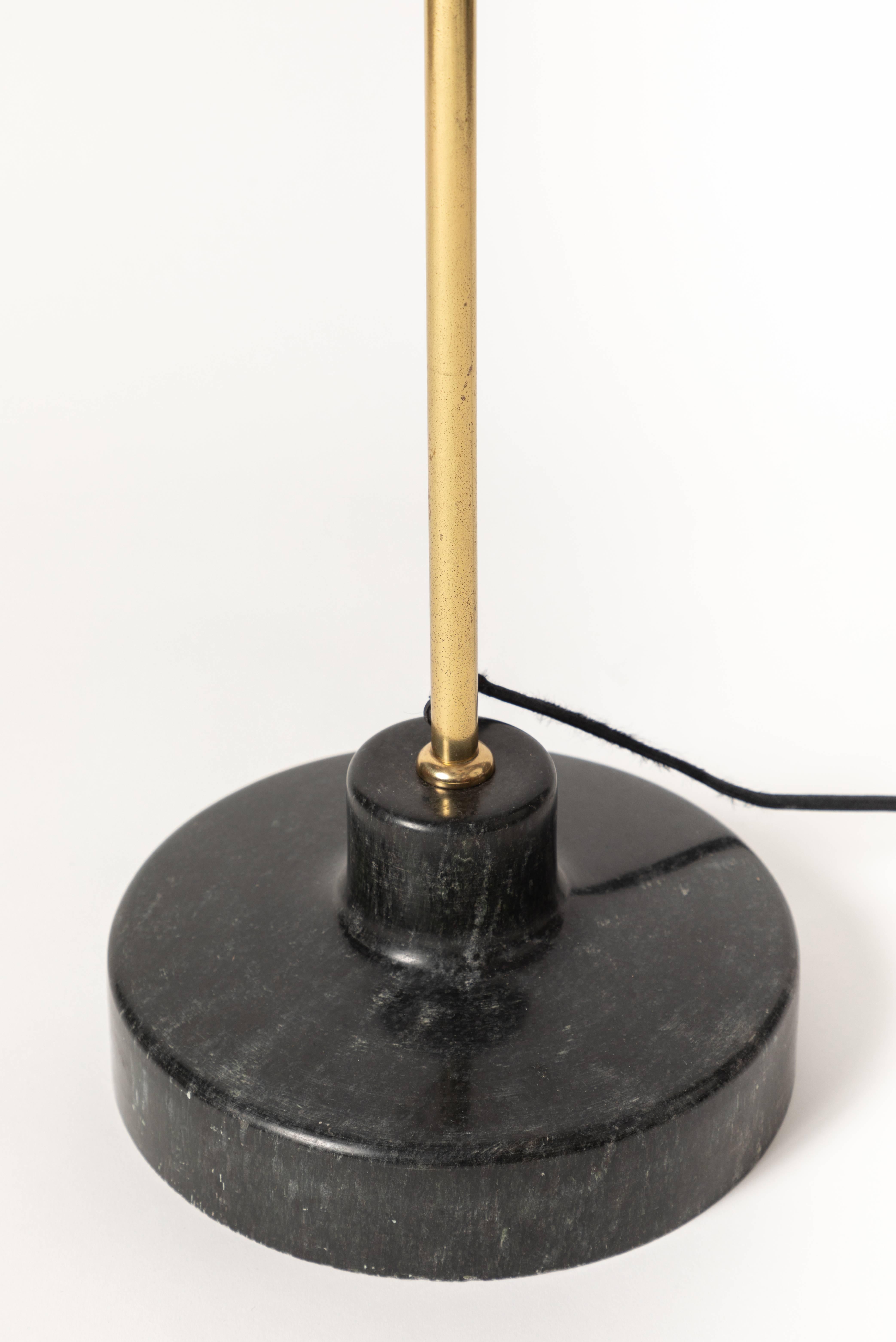 1950s Ignazio Gardella LT6 floor lamp for Azucena. This iconic and rare floor lamp is executed in brass, pressed glass, black painted metal with a solid black marble base. An incredibly refined and remarkably modern vintage midcentury floor lamp by