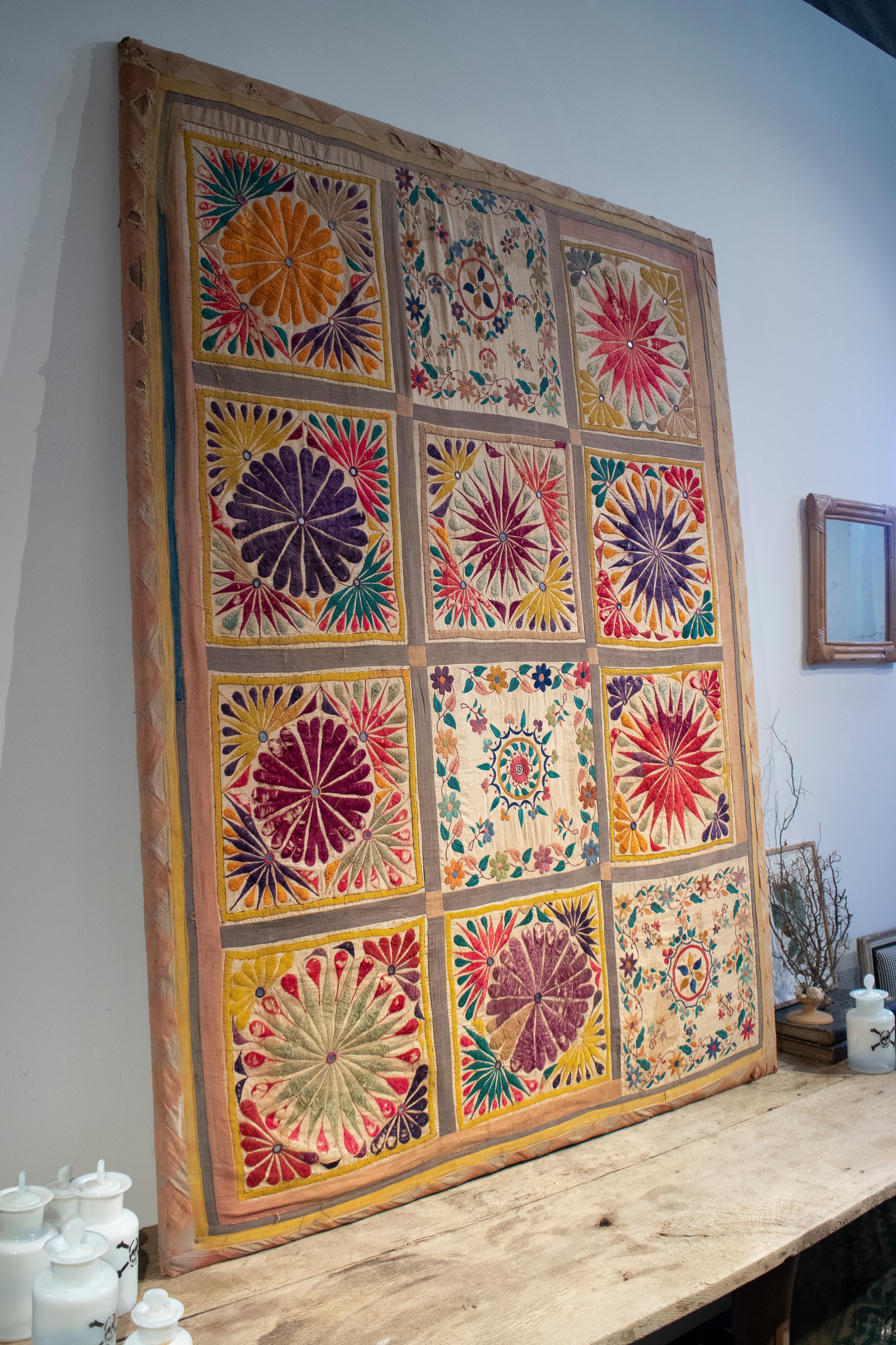 Vintage 1950s Indian hand woven tapestry quilt with colourful detailed embroidery.