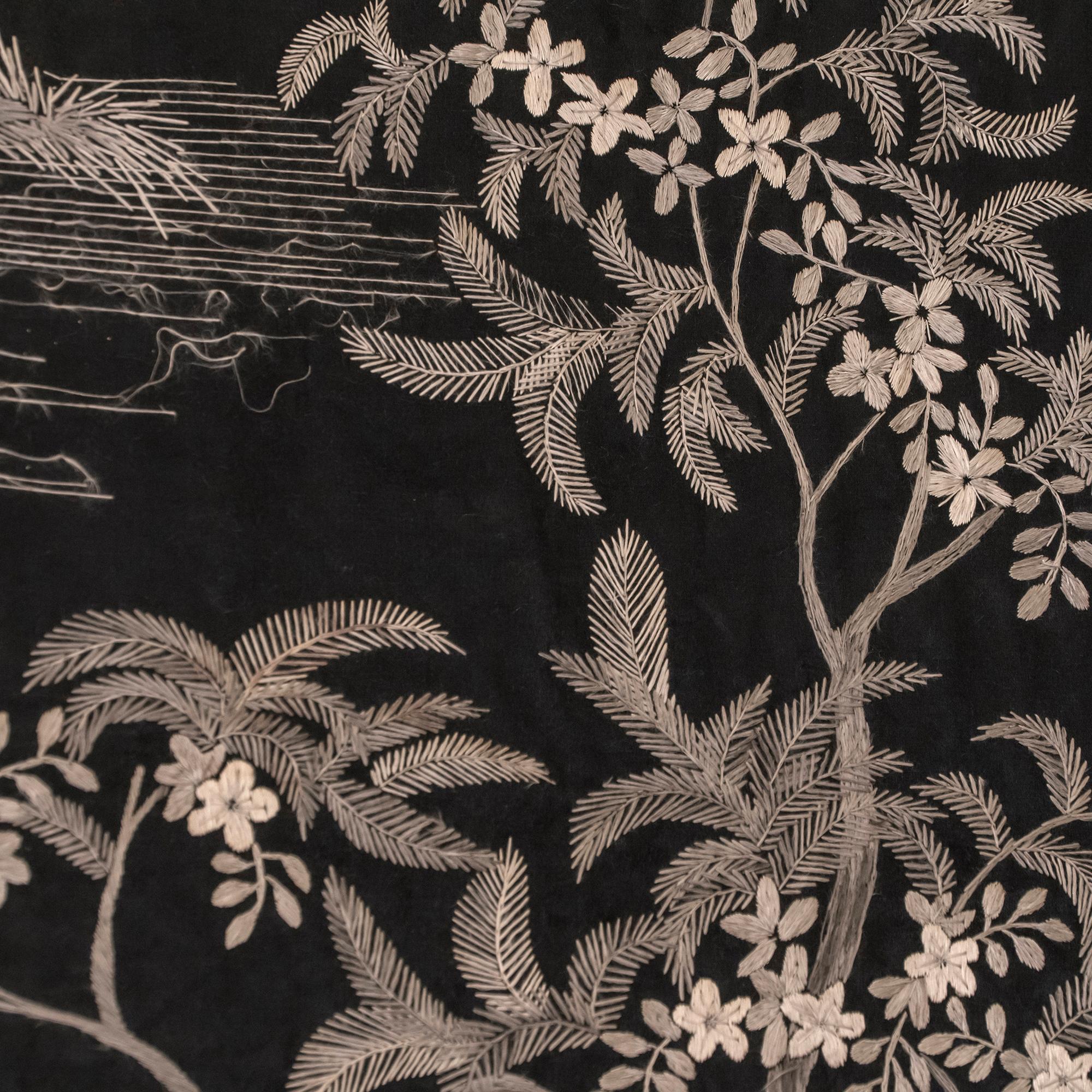 1950s Indochinese decorative wall panel, embroidered black and gold silk, framed in black wood, slight tear in the left side as in the image.
  