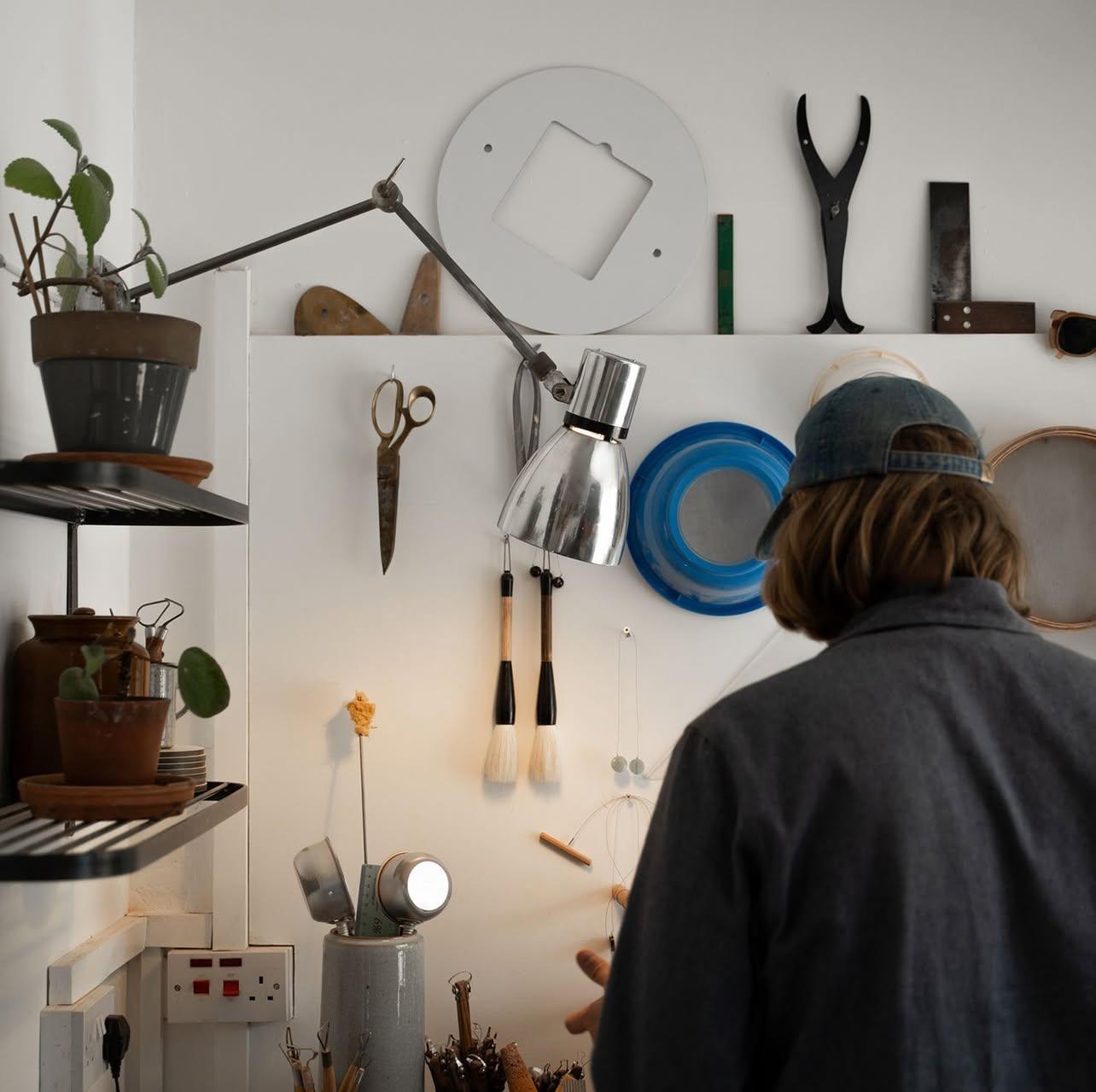 This striking 1950's cantilever wall lamp hails from an industrial site in Czechoslovakia, manufactured by Elektrosvit. The robust steel arms and swivelling aluminium shade speak to its utilitarian origins — built for function, yet dignified by