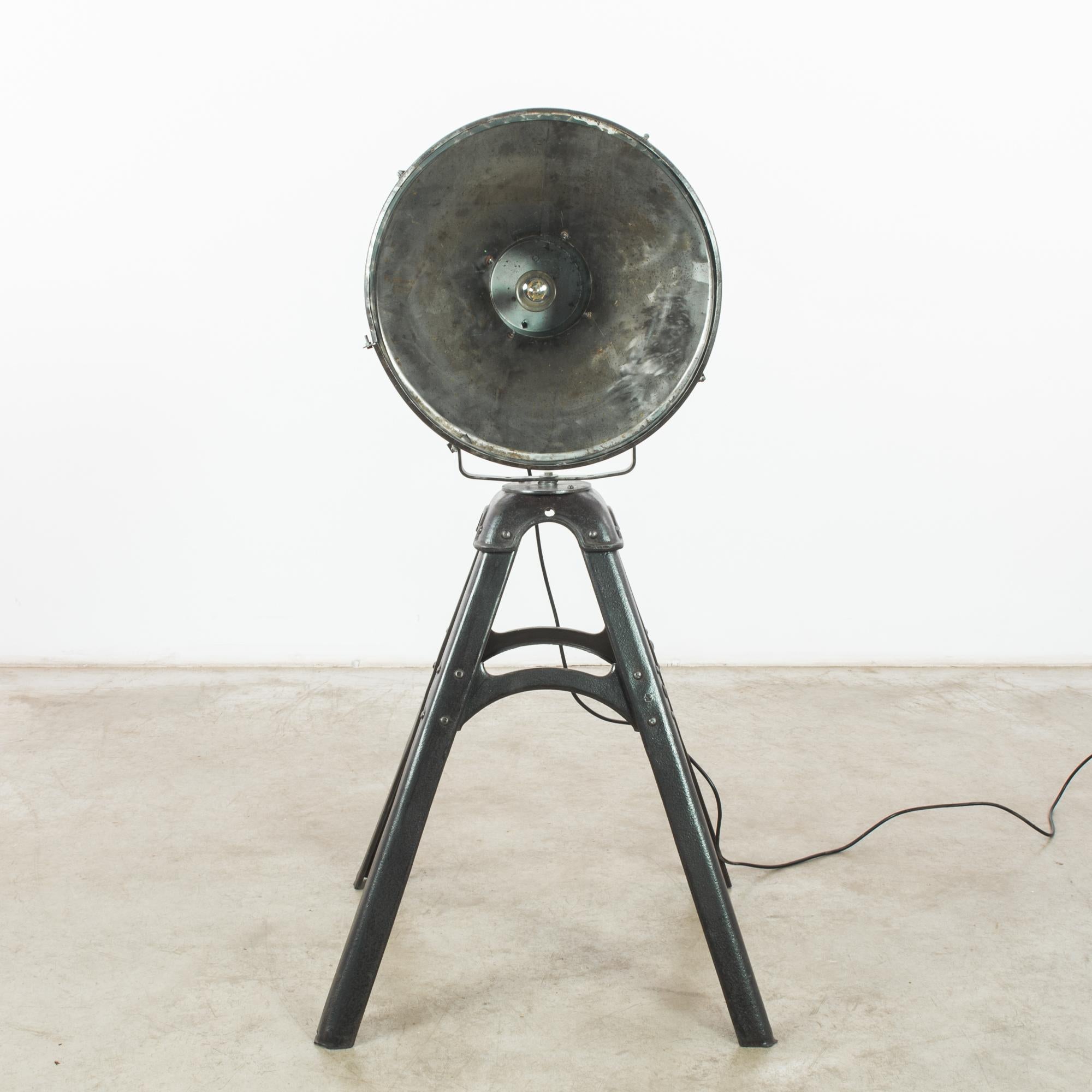 This metal floor lamp was made in the former Czechoslovakia, circa 1950. The adjustable lampshade rests on an A-frame stand with four legs. A label on the lamp indicates that it was manufactured by MSD Teplice. With its time-worn patina, this