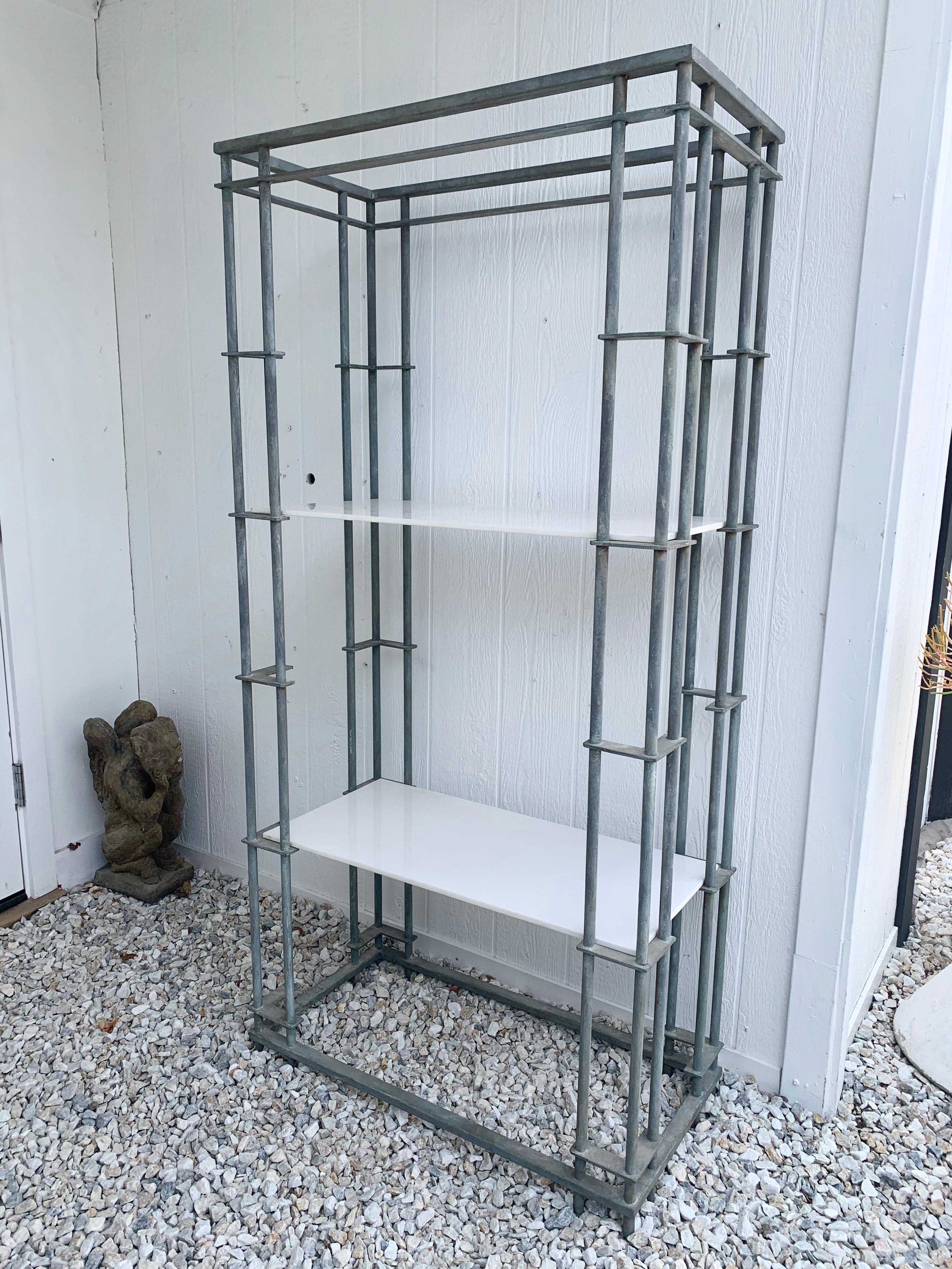 Stunning étagère with iron frame and marble shelves. Gorgeous patina to metal. Great for indoors or outdoors. Great lines. Good vintage condition.