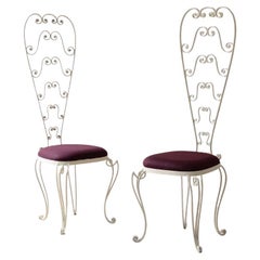 1950
s iron chairs with decorated high backs 1950
s iron chairs with decorated high backs