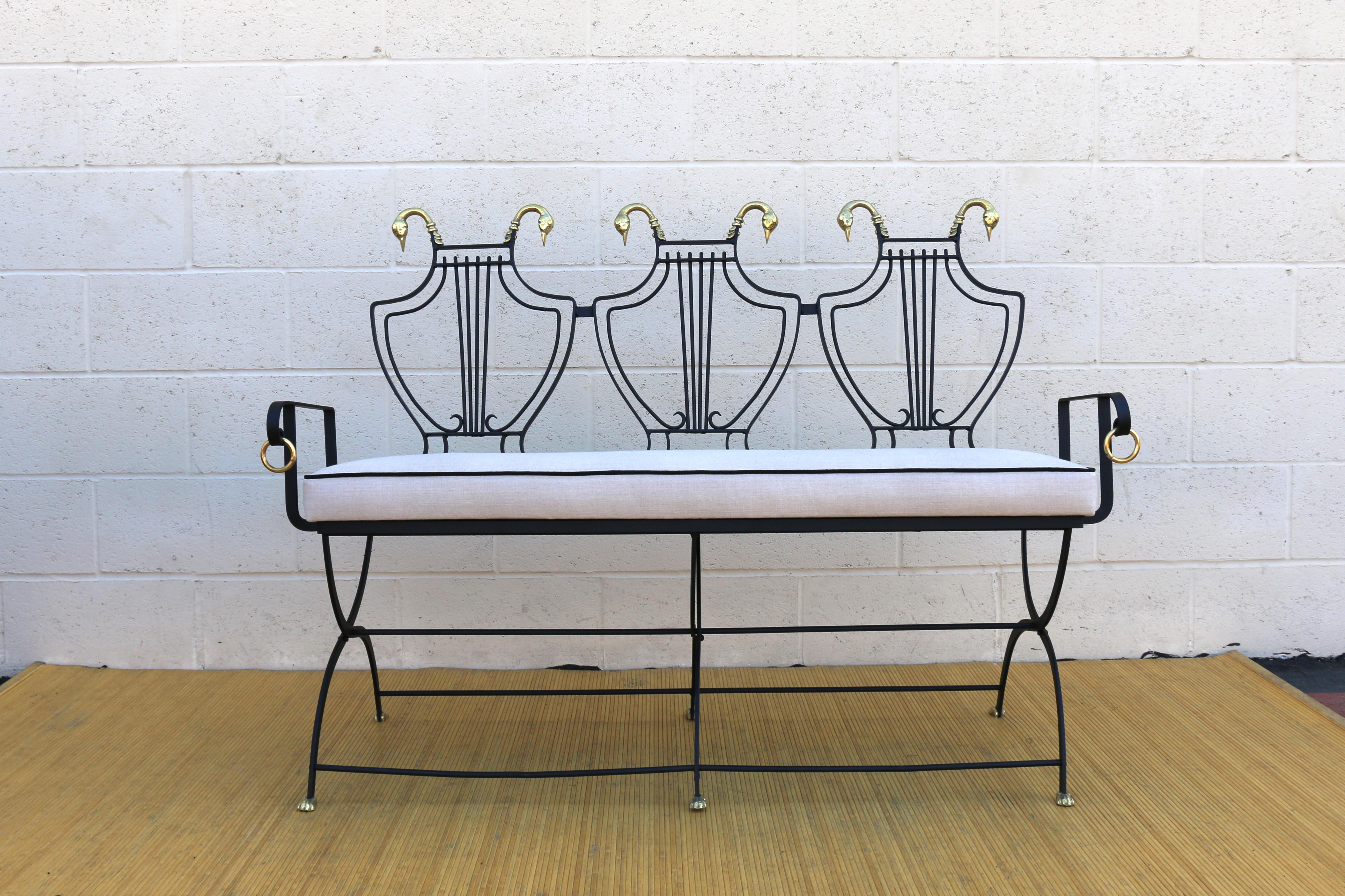 Wonderful vintage iron settee designed by Maison Jansen, ( it has no maker’s mark ). This beautiful piece is original from the Mid 20th Century. The bench is made of metal and has a great lyre back design. It can be folded but you need to take the