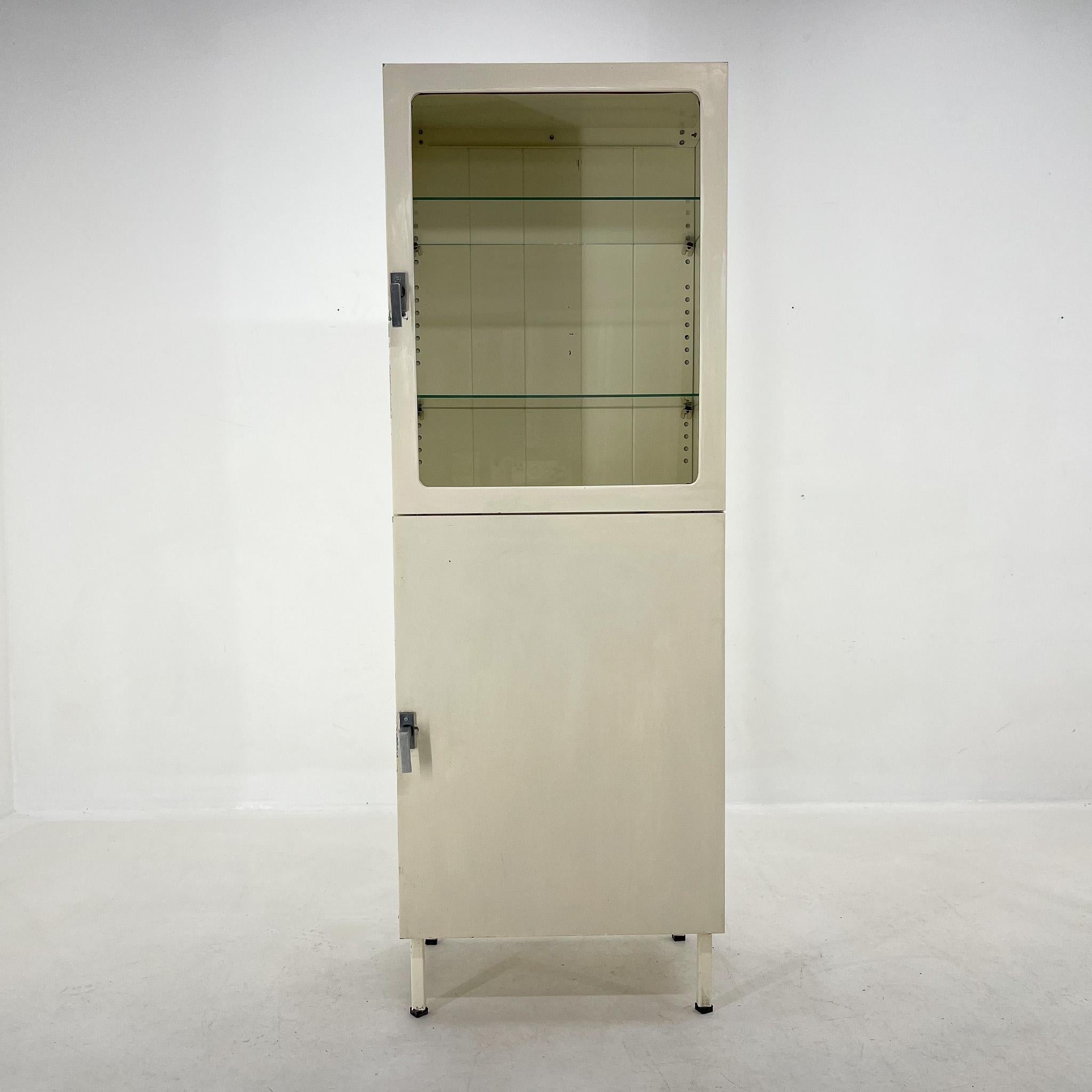 Iron and glass medical cabinet, made in the 1950's in former Czechoslovakia.