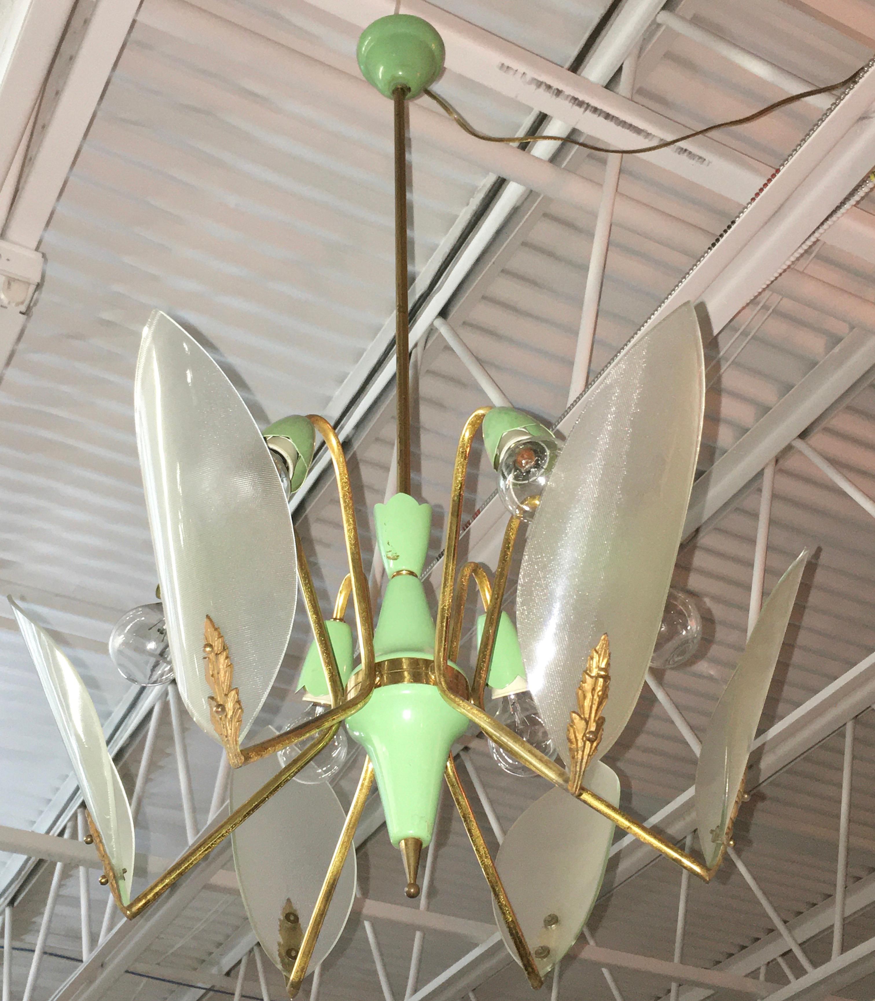 Original 1950's Italian chandelier consisting of original green enameled aluminum spun double-top cluster body supporting six brass spider-like arms each of which holds a leaf shaped textured glass reflector towards a green enameled aluminum petal