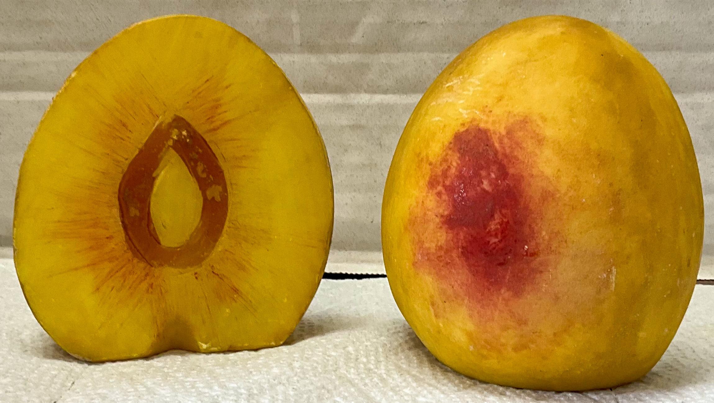 This is a rare pair of large stone fruit bookends! They are large peach halves. They do have a flat bottom for sound support of your books. They are Italian and date approximately to the 50s.