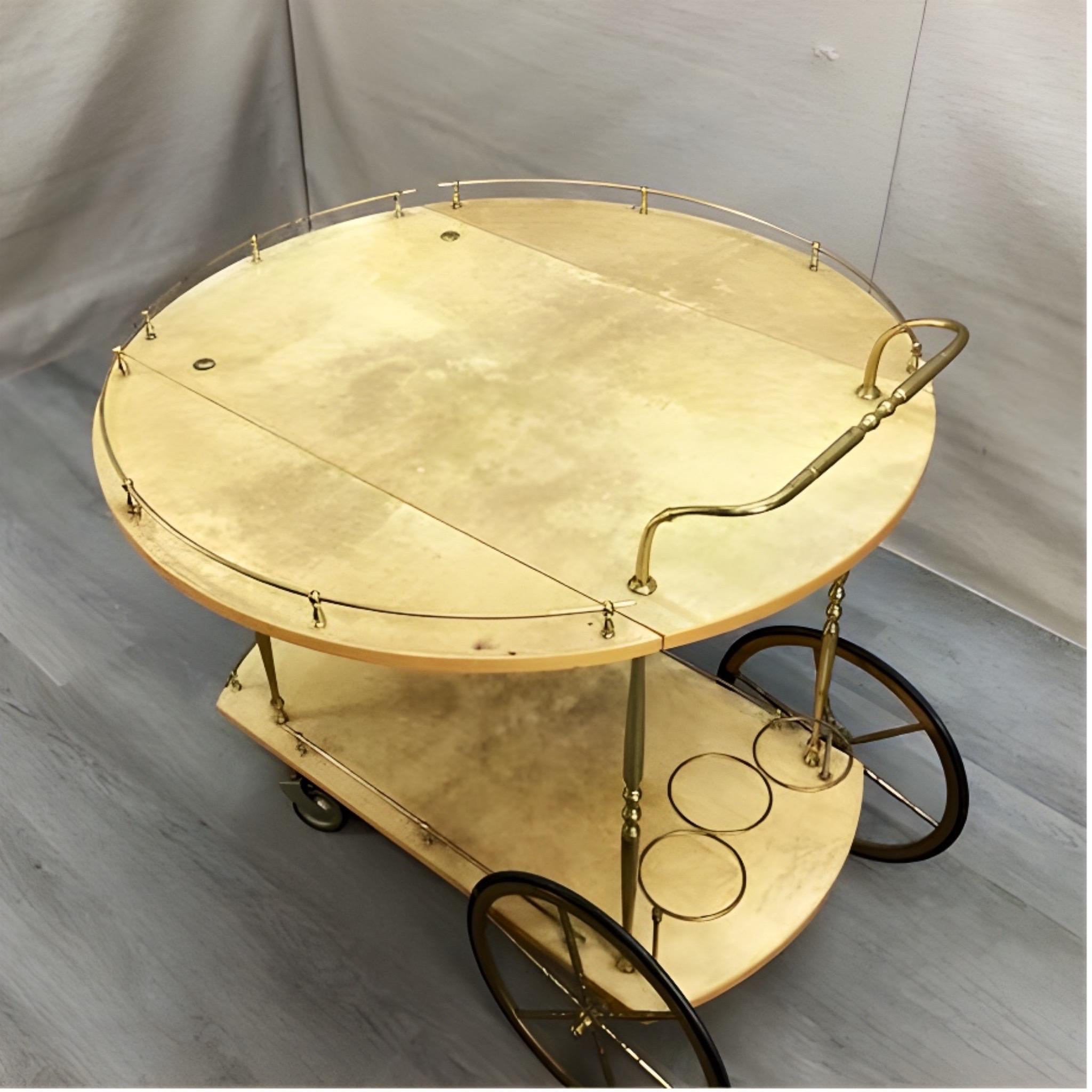 Beautiful 1950s bar cart by Italian artist-craftsman Aldo Tura, featuring the designers distinct use of brass and lacquered goatskin that Tura was well-known for. The quality of Aldo Tura's craftsmanship can be attributed to the fact that his work