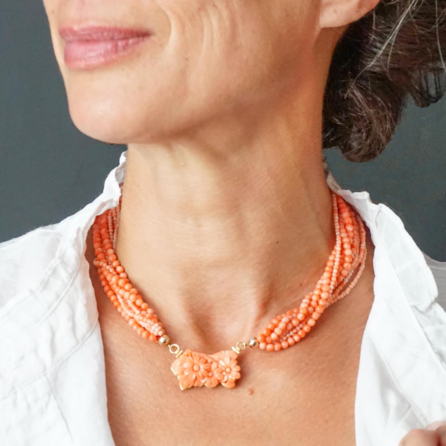 Glamorous 1950s Midcentury statement piece choker necklace which features eight strands of light orange pink coral beads. This colour is also know as Angel Skin. The 4 strands of 4mm beads and 4 strands of 2mm beads are attached to a 18KT gold