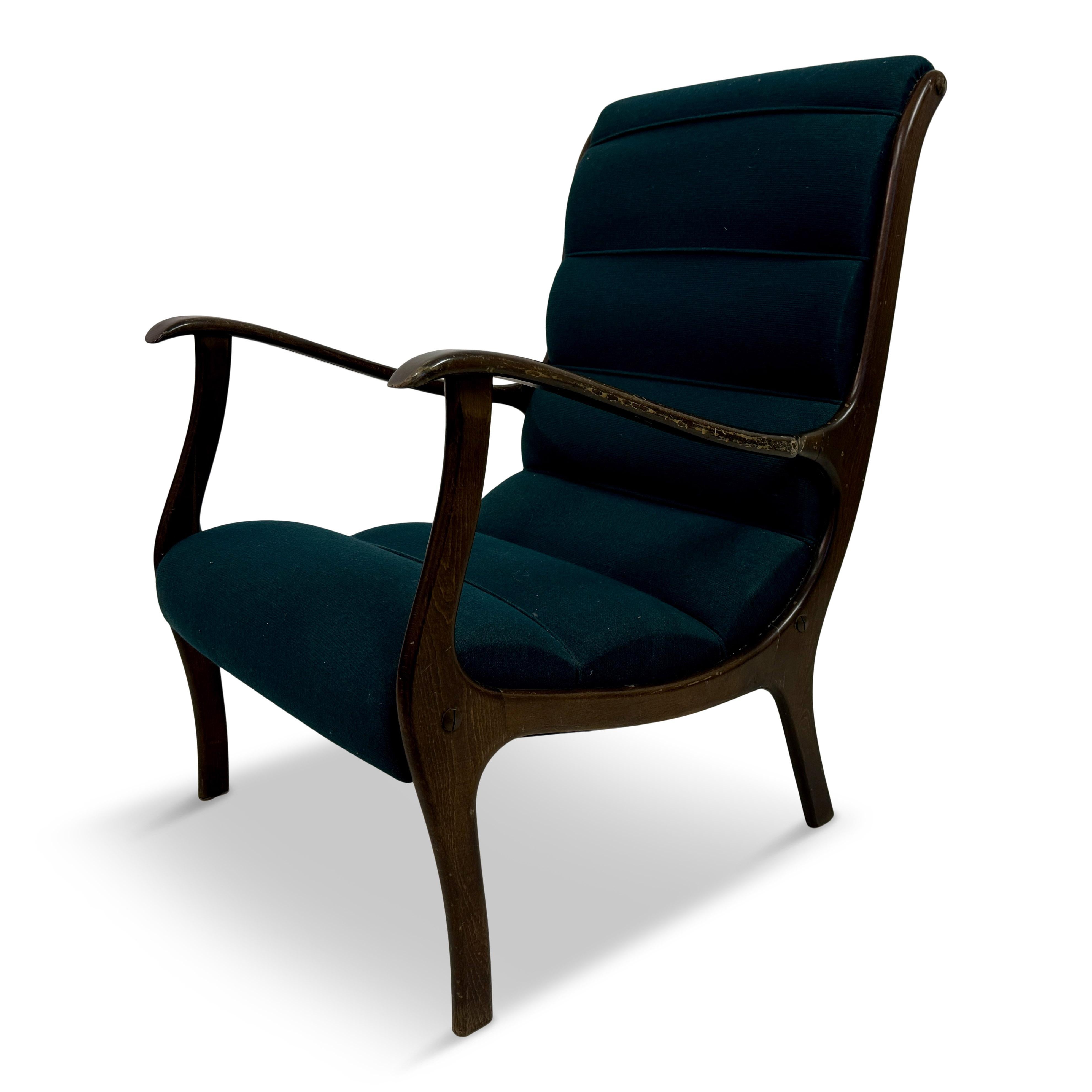 Armchair

By Ezio Longhi

Italian 1950s

This Italian armchair exudes elegance with a touch of mid-century sophistication, from the 1950s and attributed to designer Ezio Longhi. The chair features a ribbed backrest and seat upholstered in a deep,