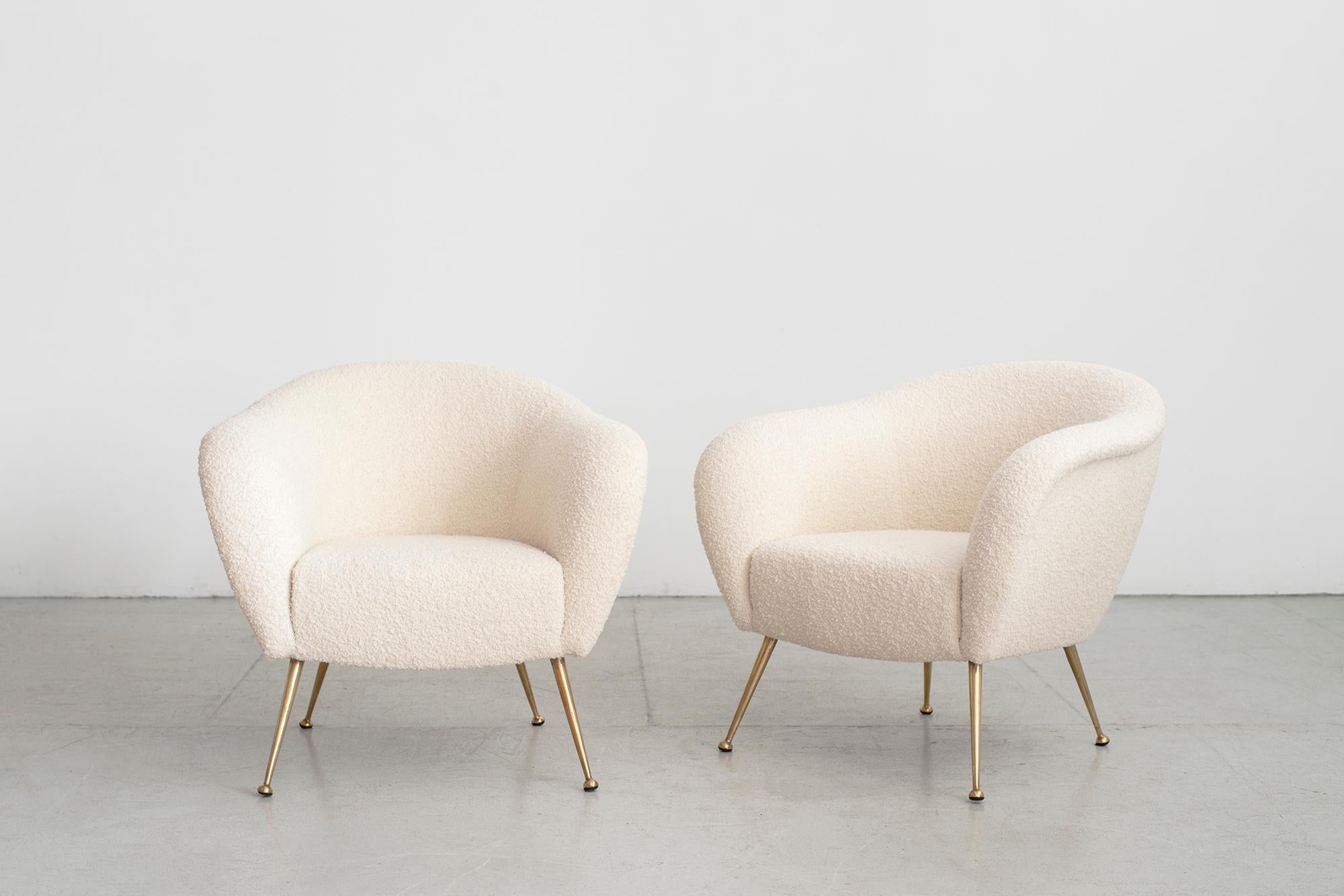 Pair of 1950s Italian armchairs with curved lines, brass legs
Nice sleek shape and curves.
Reupholstered in creamy white boucle.