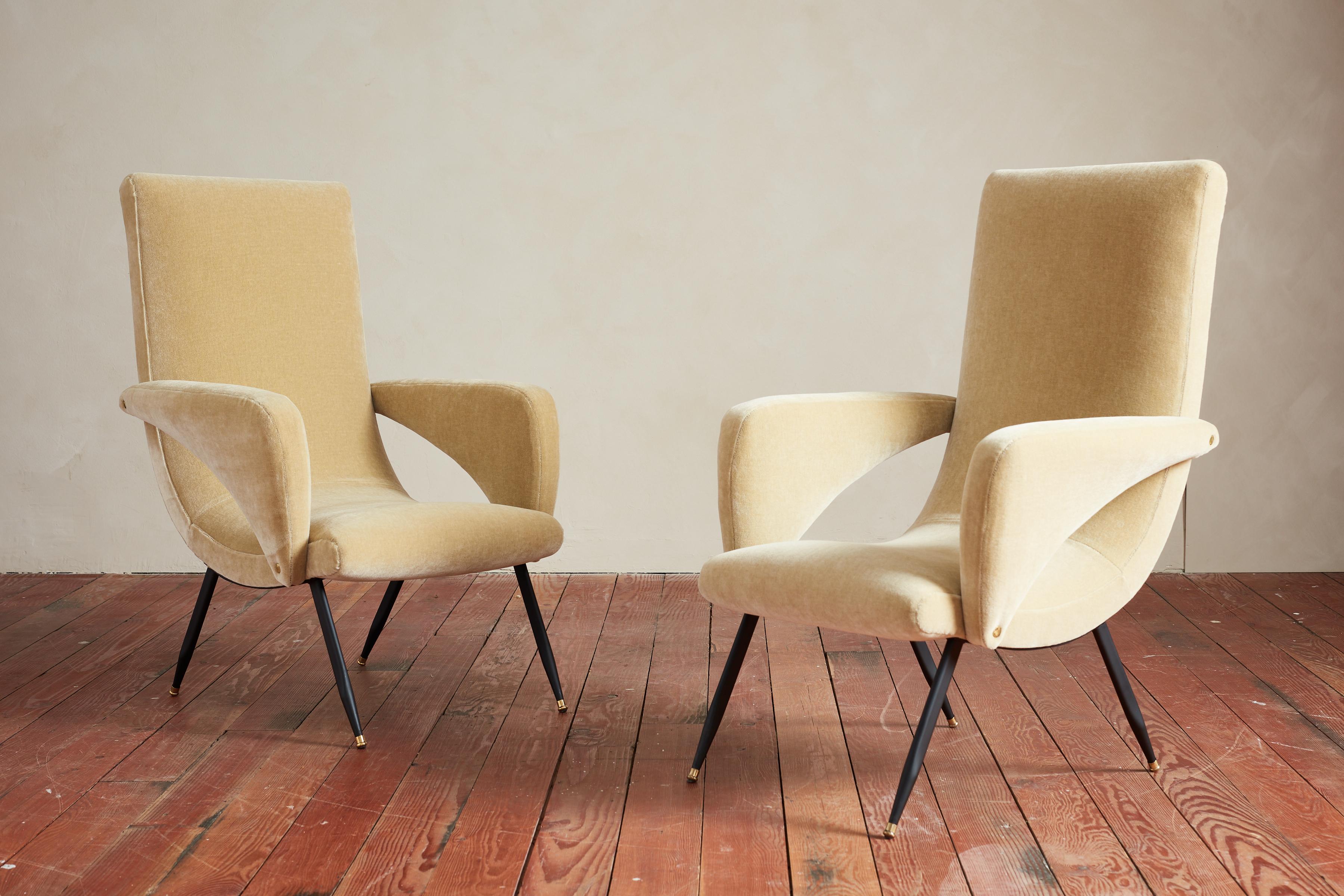 Wonderful pair of 1950's Italian armchairs with open arm shape and black iron base.  Great angular shape newly upholstered in a buttery mohair. 

Italy, 1950s