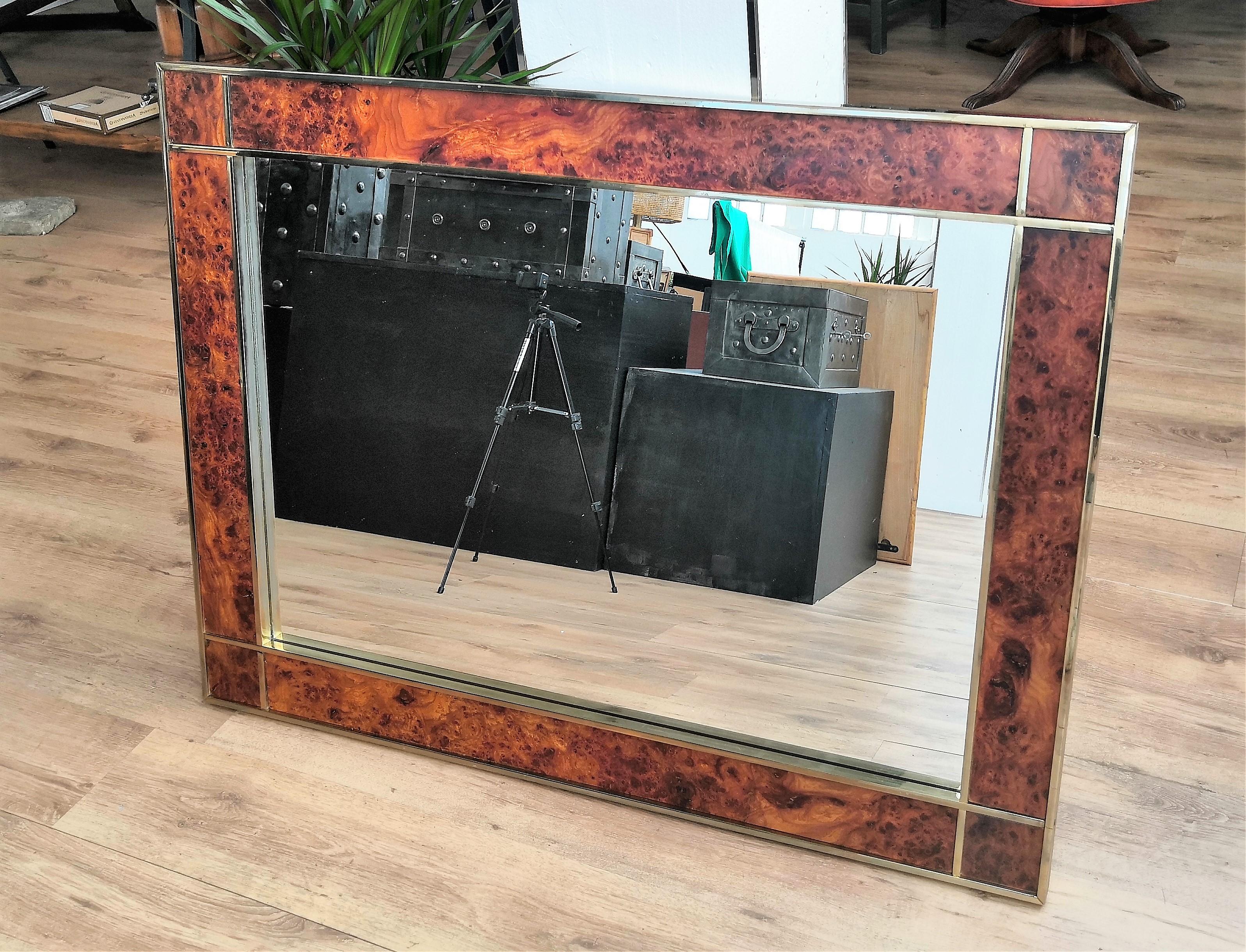 Very elegant Italian Art Deco Regency mirror with beautiful and iconic frame in walnut burl elm and brass. The mirror measures cm 120 x 90, inches 47.24 x 35.43, shows minor fading scratches and slight oxidation on the sides, while the front and