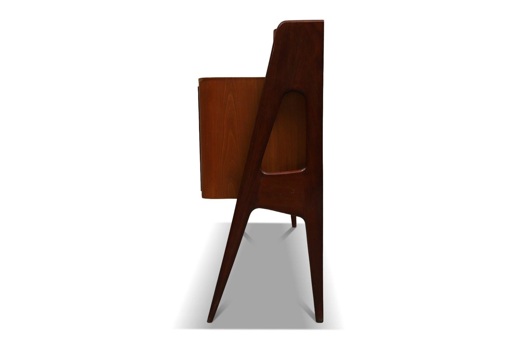 Origin: Italy
Designer: Vittorio Dassi (attributed)
Manufacturer: Dassi
Era: 1950s
Materials: Lemon Wood
Measurements: 67″ wide x 18″ deep x 43″ tall