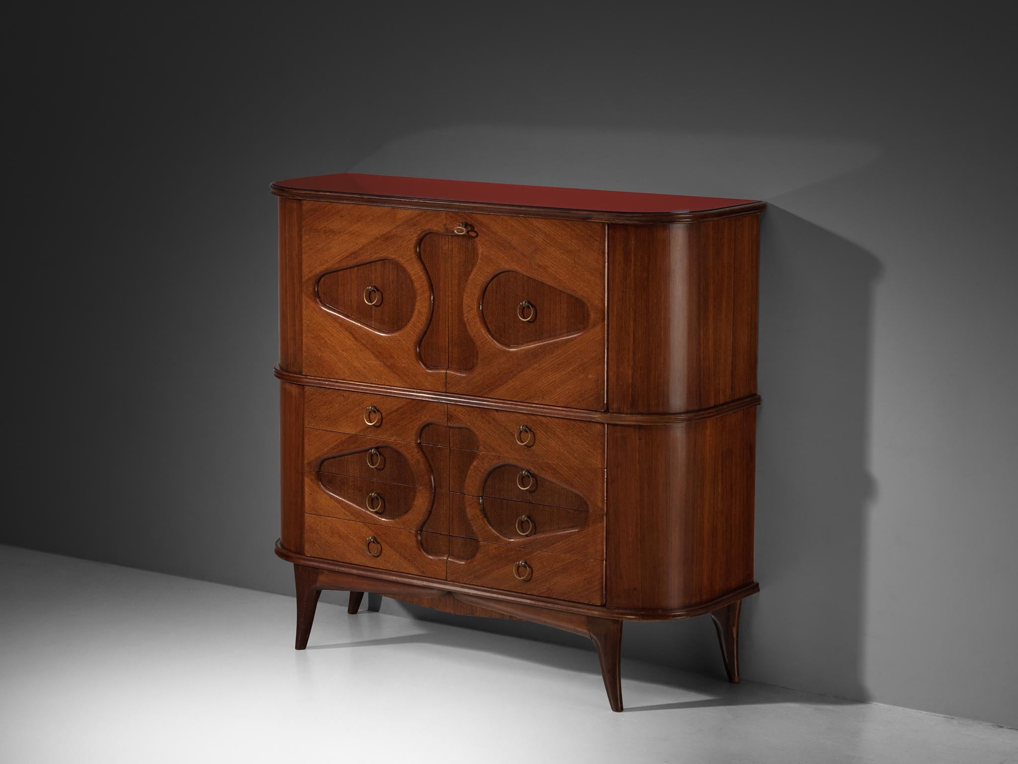 Meuble de bar, acajou, bois, laiton, verre, Italie, années 1950

Un superbe meuble de bar italien des années 1950, réalisé de main de maître en acajou. Cette pièce séduit par ses sculptures décoratives organiques en forme d'œil sur le devant. Les