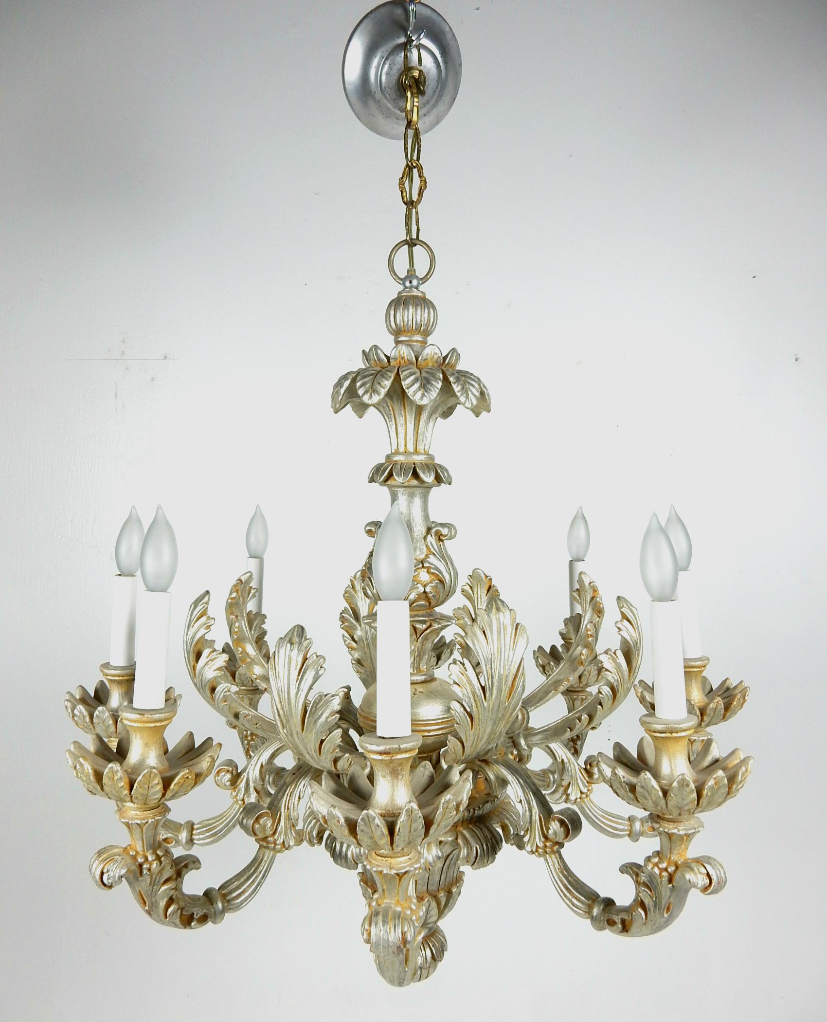 Gorgeous 1950s large Italian Baroque silverleaf chandelier.
8 candlestick bulb sockets. Measures 30 inch wide and 34 inch tip to tip of ceiling cap.
Excellent vintage condition with no broken or repaired parts. Ready to hang.