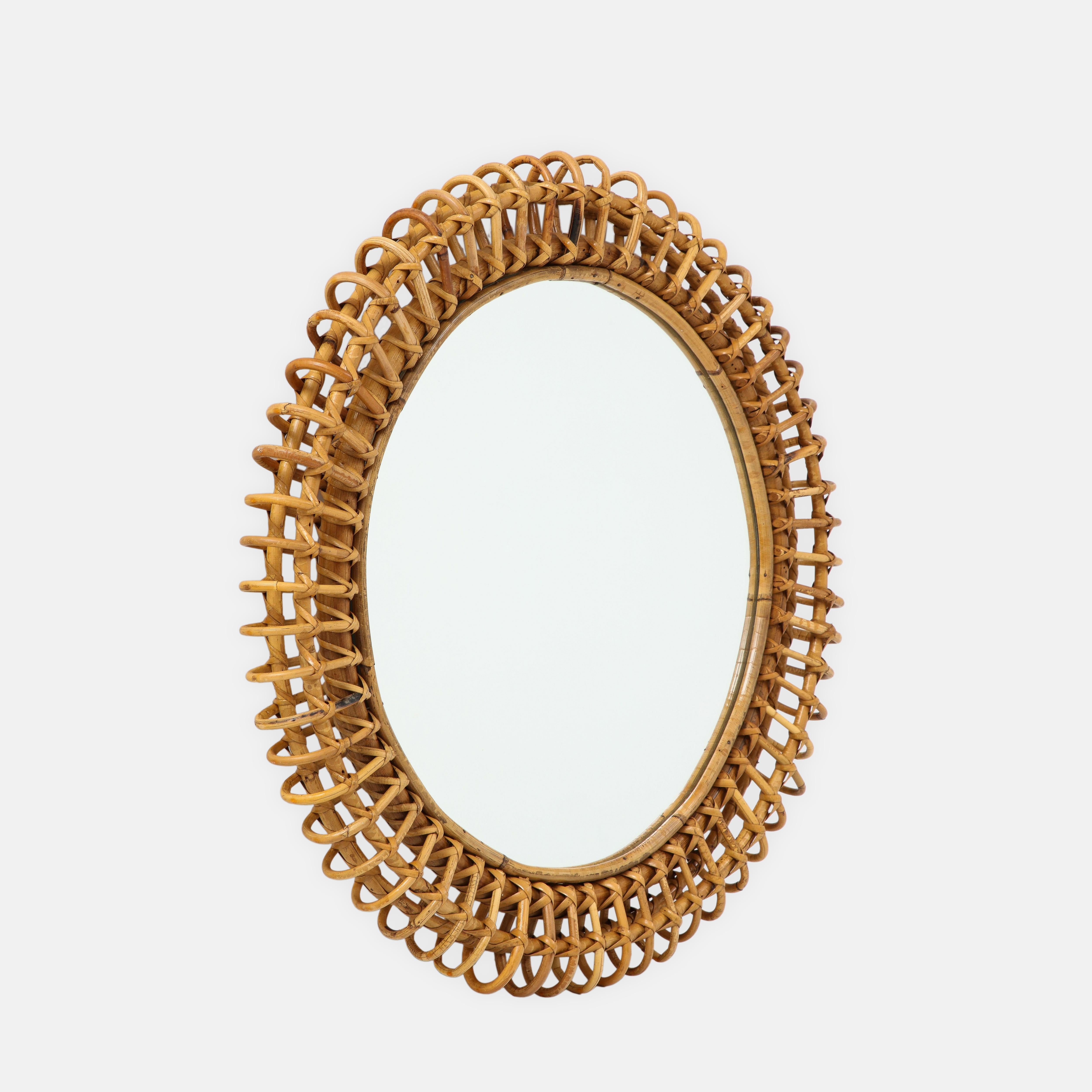 1950s Italian Bonacina round wall mirror composed of bamboo frame finely woven with rattan.