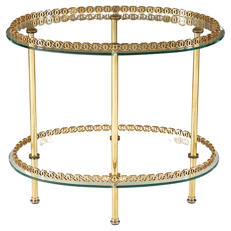 https://a.1stdibscdn.com/1950s-italian-brass-and-glass-oval-table-for-sale/f_8972/f_279818821648464291975/f_27981882_1648464292723_bg_processed.jpg?width=768