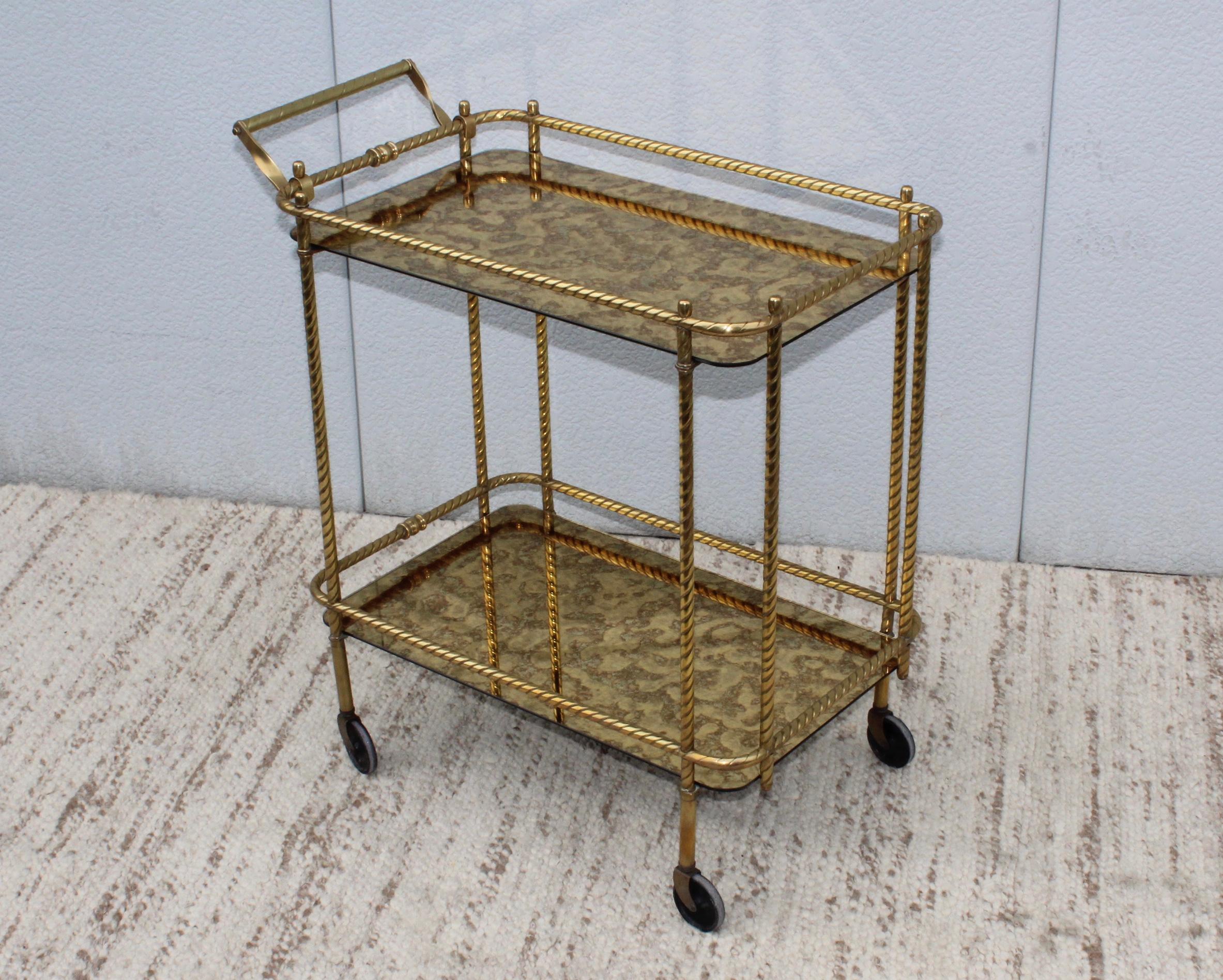 1950s large Italian scrolled brass bar cart. With original glass.