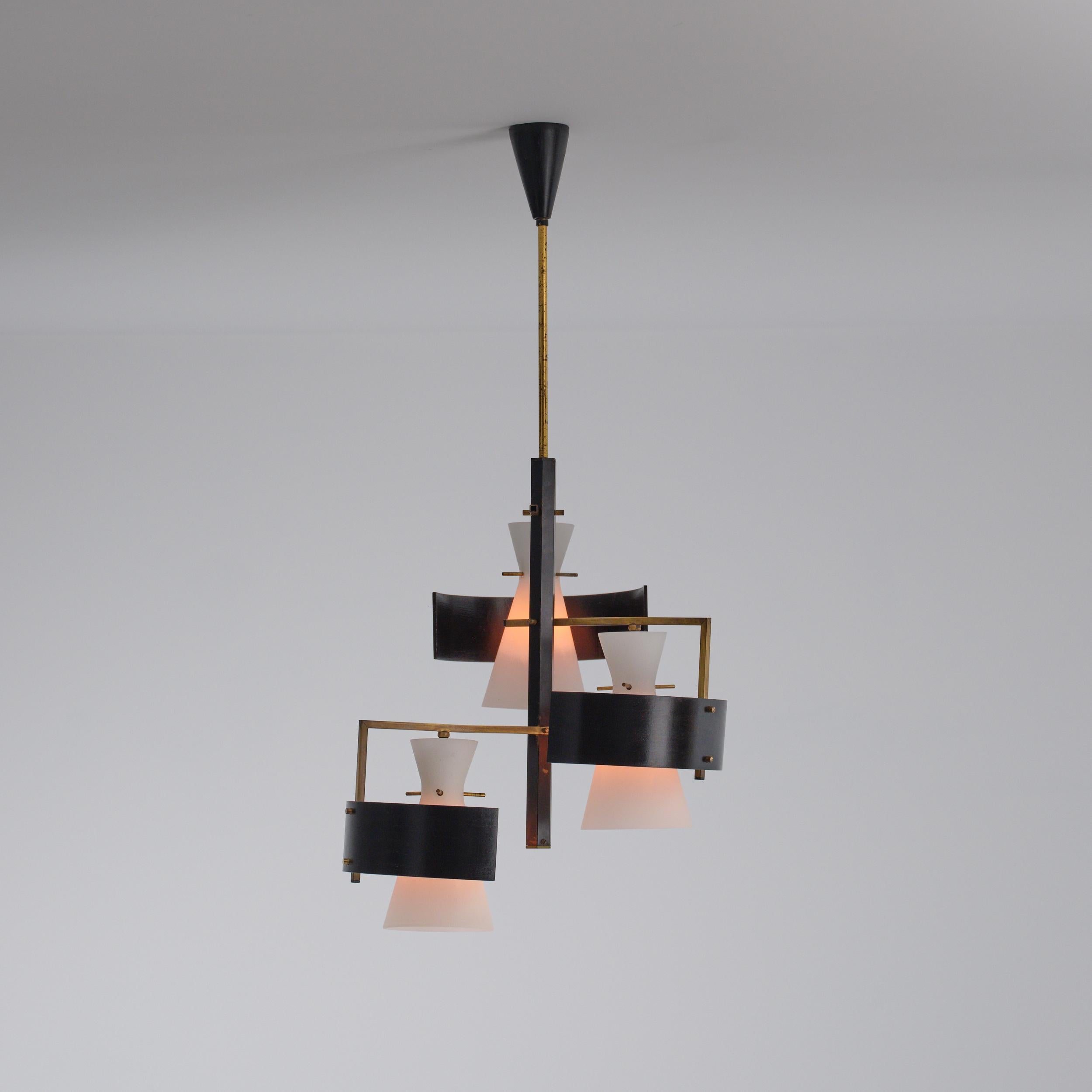 Three-light ceiling fixture from the 1950s, attributed to Stilnovo. The structure combines a central black-lacquered stem with brass cross-arms and hardware. Each light features an opaline glass shade shaped as a truncated cone, partially encircled