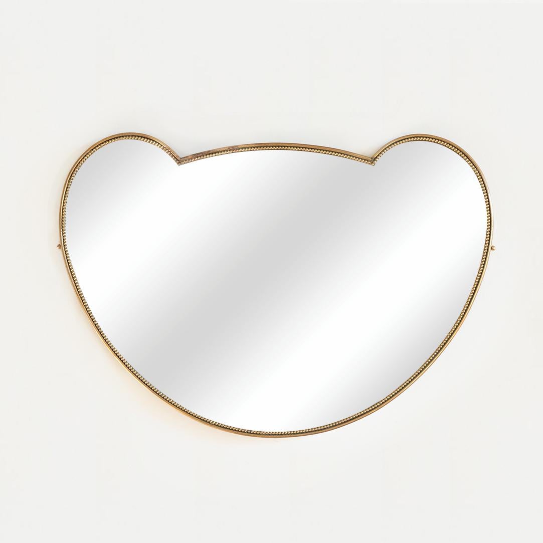 Beautiful vintage heart shaped brass mirror from Italy, 1950's. Unique shape with nice age and patina to brass. 

