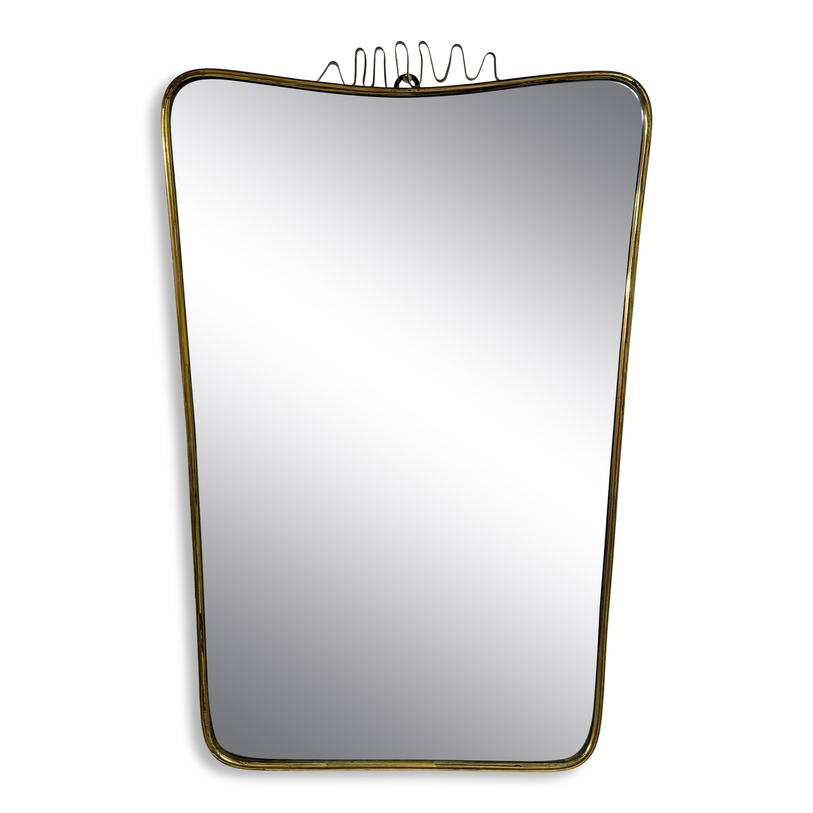 Miroir

Cadre en laiton

Fil métallique plat en laiton

Patiné

Très légères rousseurs sur le miroir

Italie années 1950

