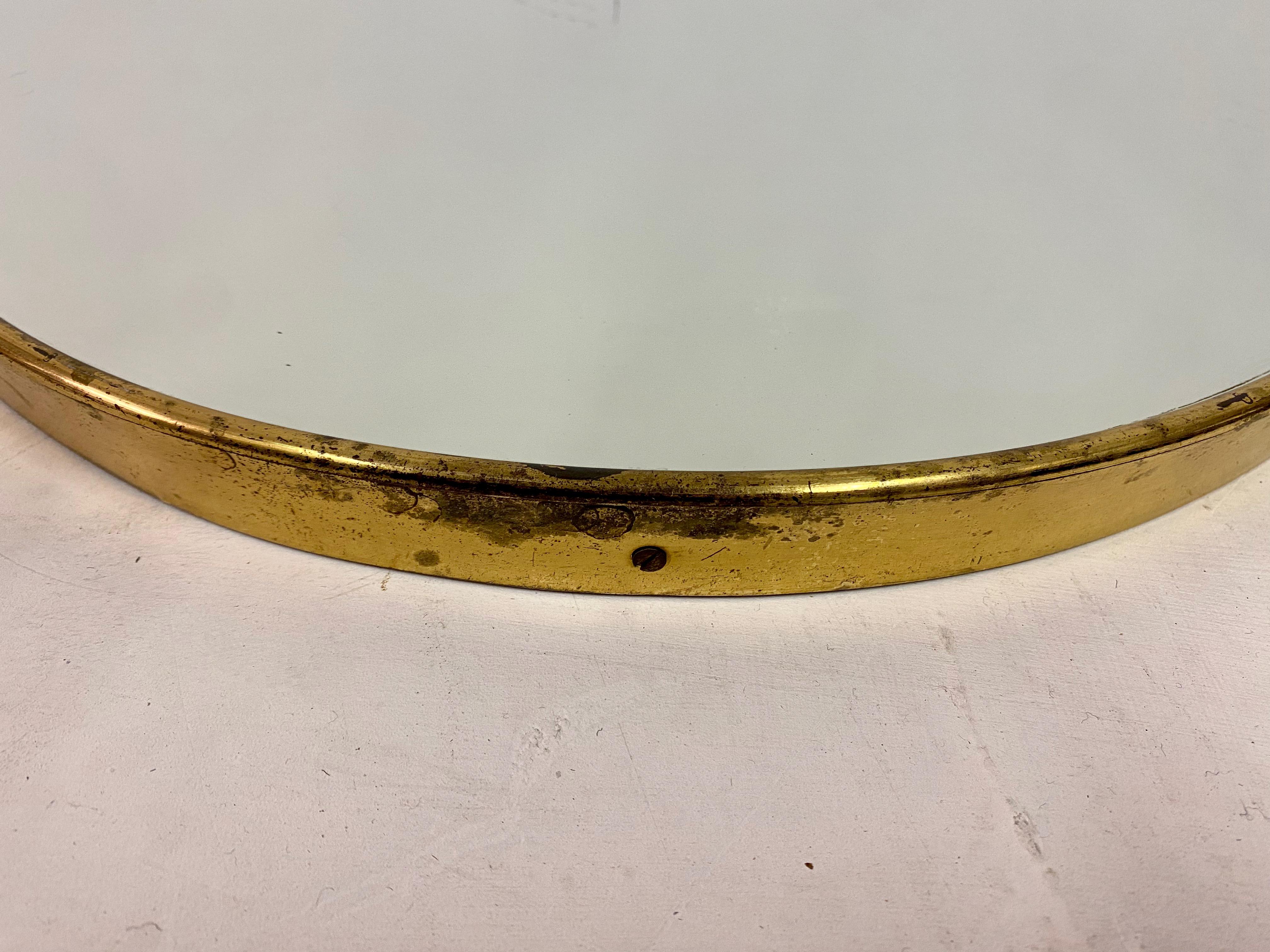 brass shield mirror
