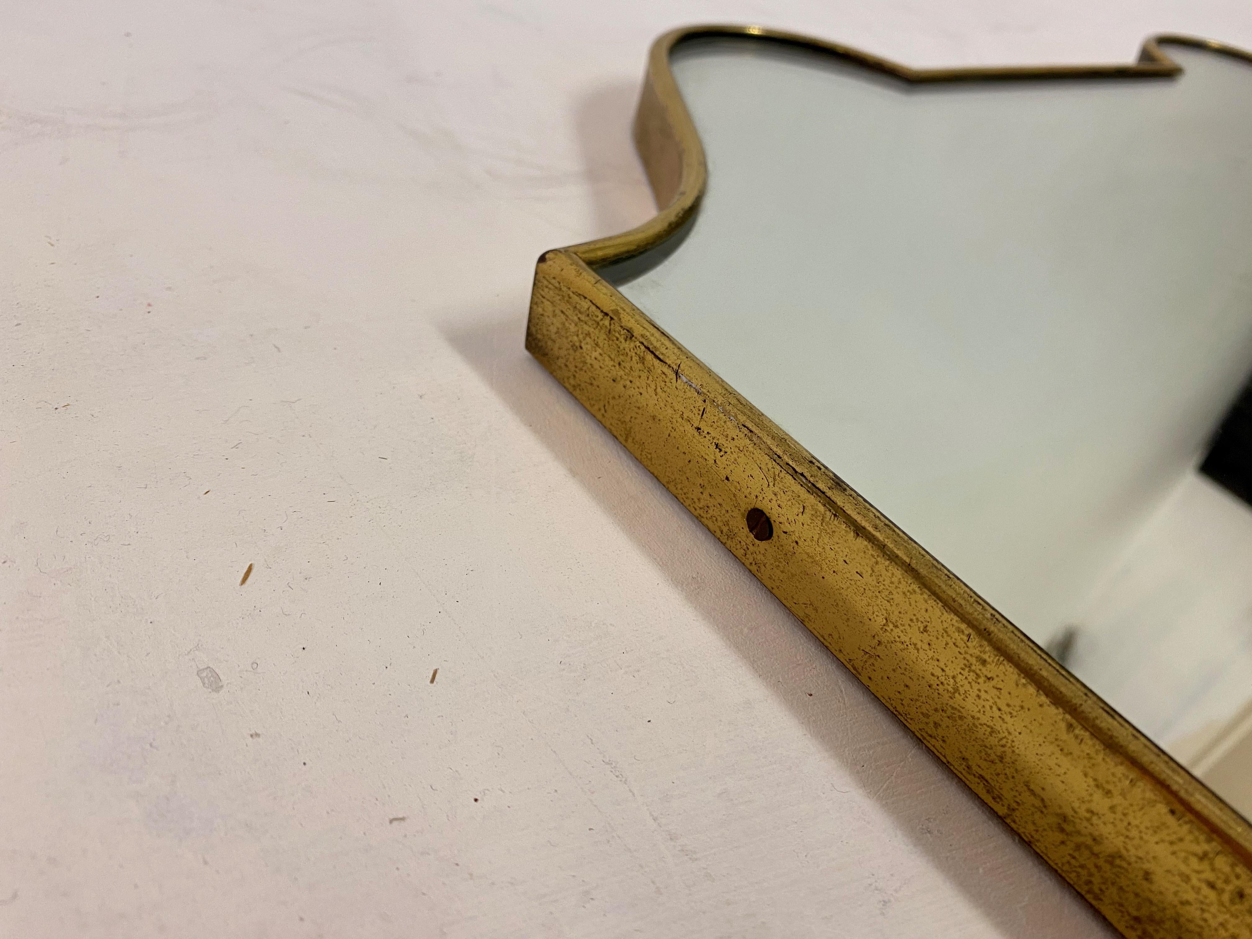 20th Century 1950s Italian Brass Shield Shaped Mirror For Sale