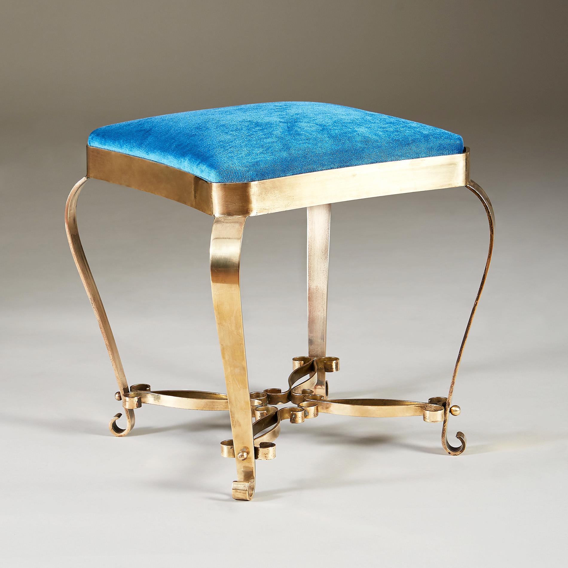Elegant vintage dressing-table/occasional stool with decorative brass scroll detailing to legs and frame. The frame is held by four curved brass supports meeting as a decorative flower of small brass circles. Recently re-upholstered in turquoise